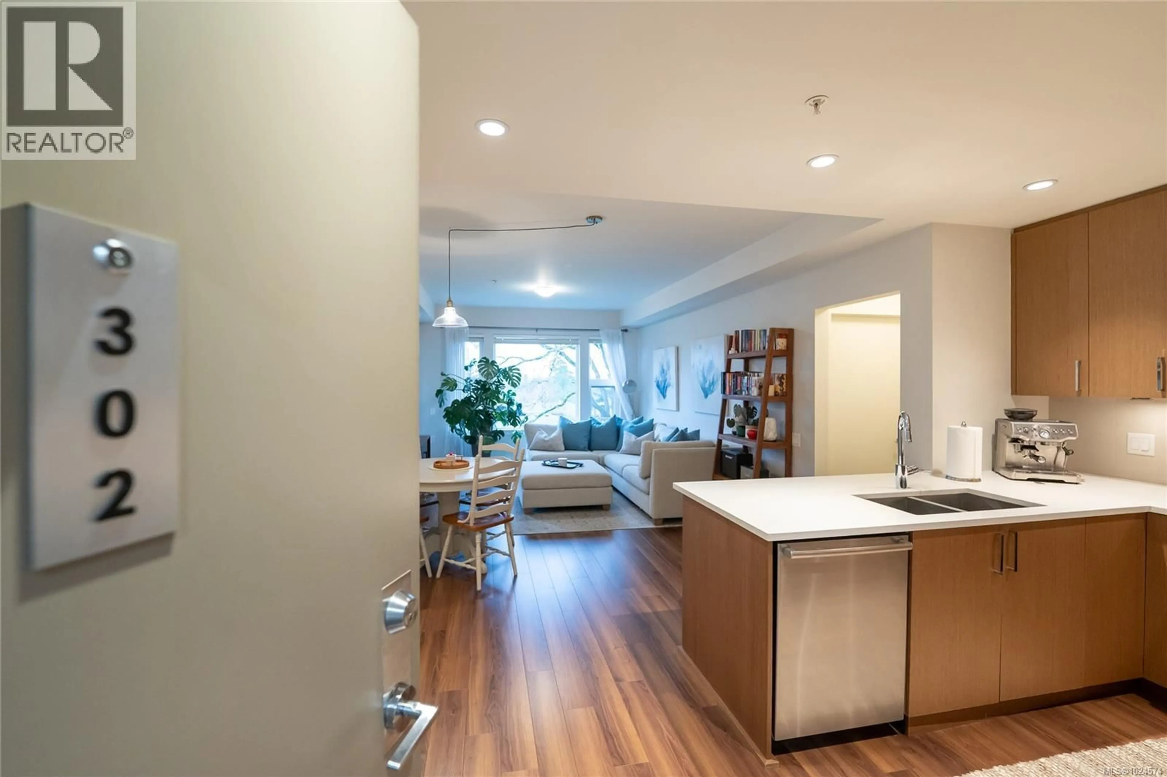 Open concept kitchen, wood/laminate floor for 302 - 3912 CAREY ROAD, Saanich British Columbia V8Z4E2