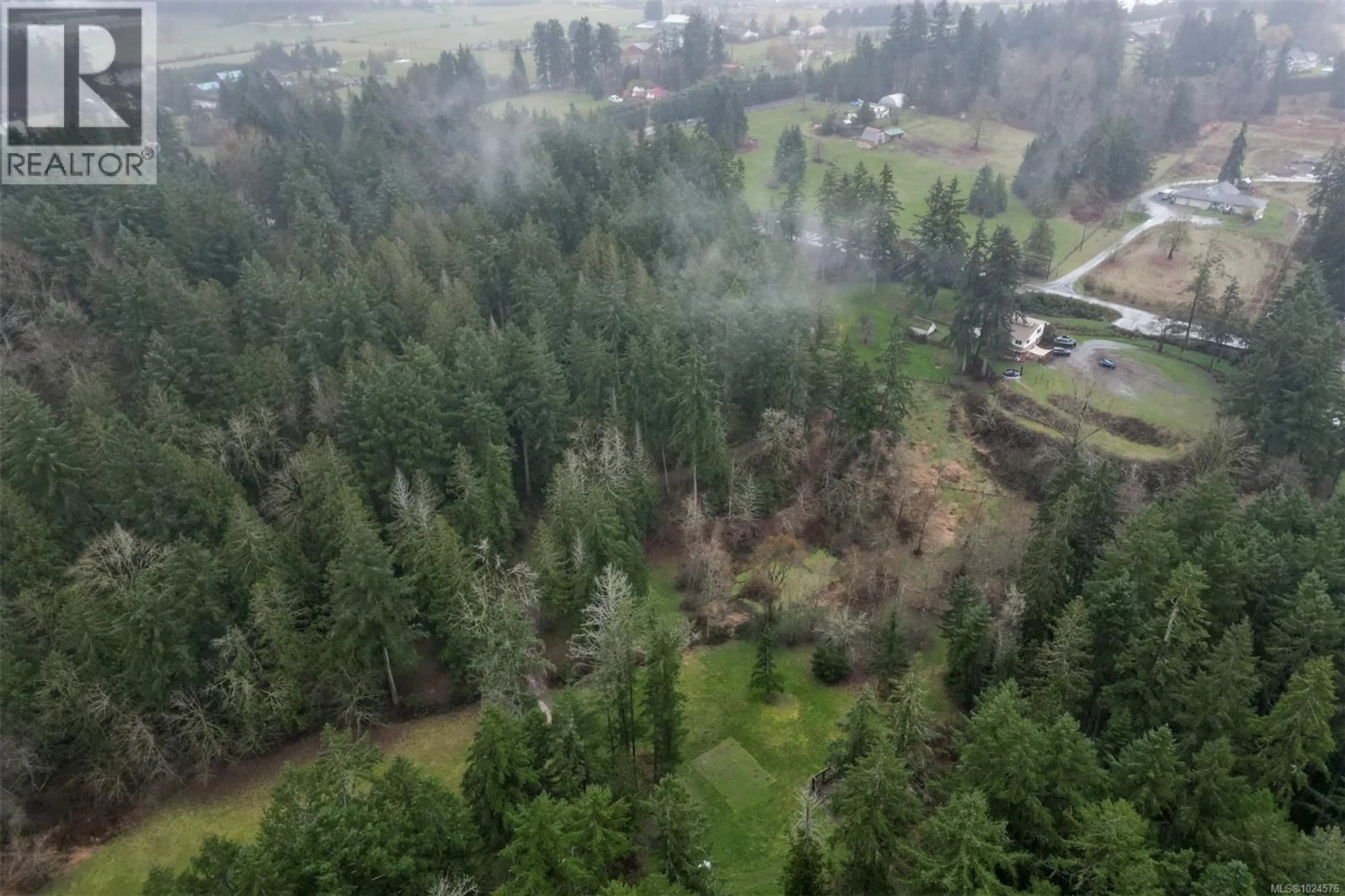 A pic from outside/outdoor area/front of a property/back of a property/a pic from drone, forest/trees view for 2035 HERD ROAD, Duncan British Columbia V9L5W3
