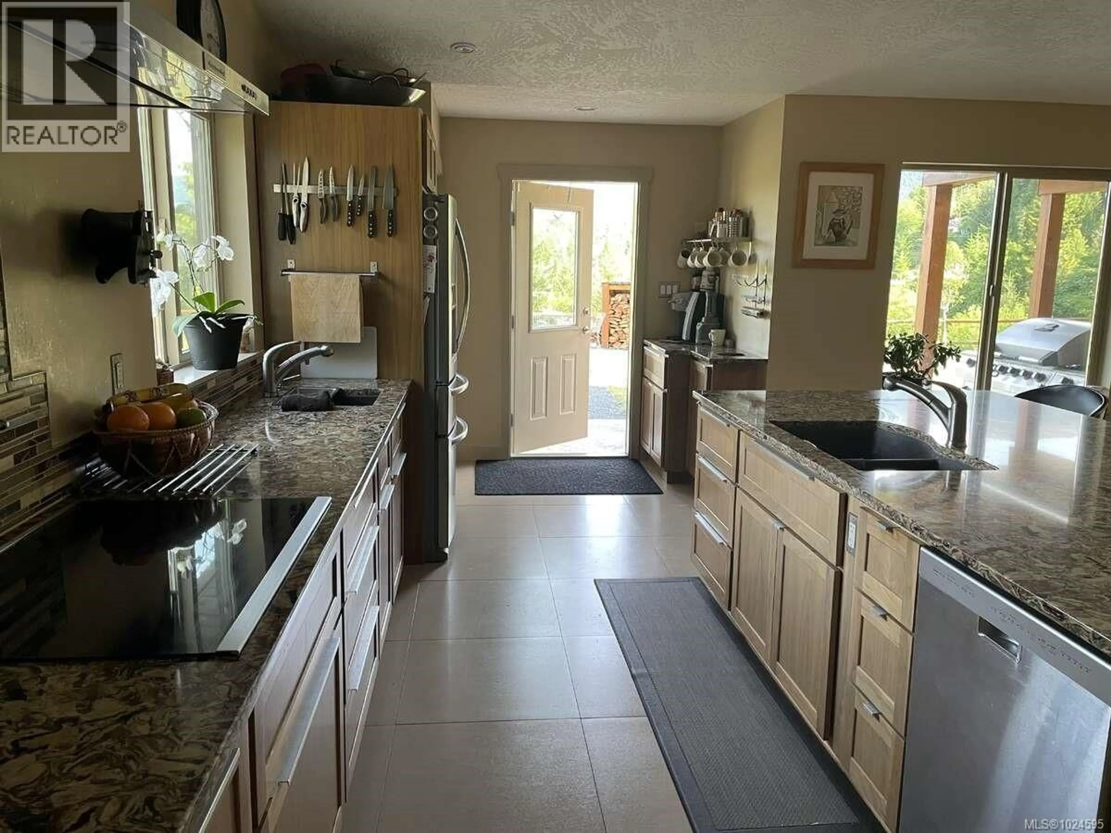 Open concept kitchen, ceramic/tile floor for 1680 PELIGREN PLACE, Qualicum Beach British Columbia V9K2S3