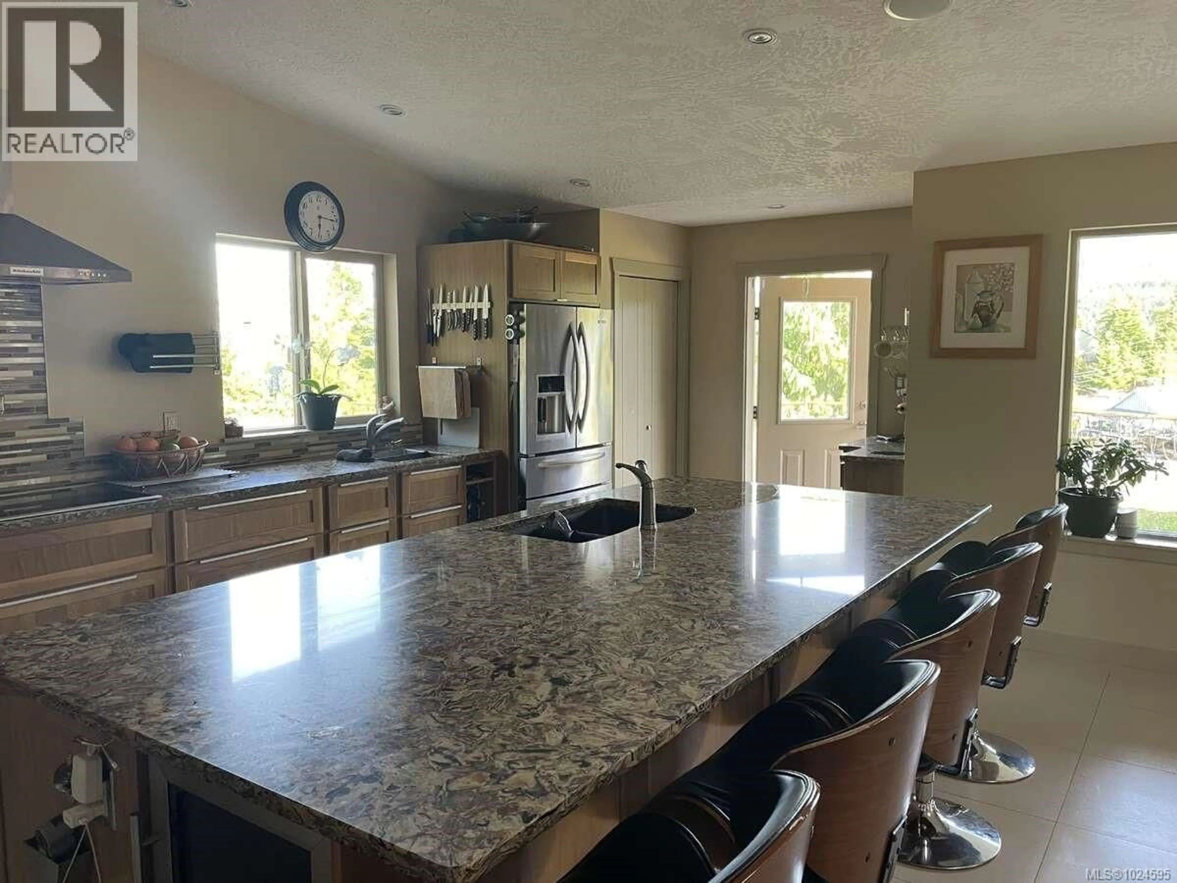 Open concept kitchen, ceramic/tile floor for 1680 PELIGREN PLACE, Qualicum Beach British Columbia V9K2S3