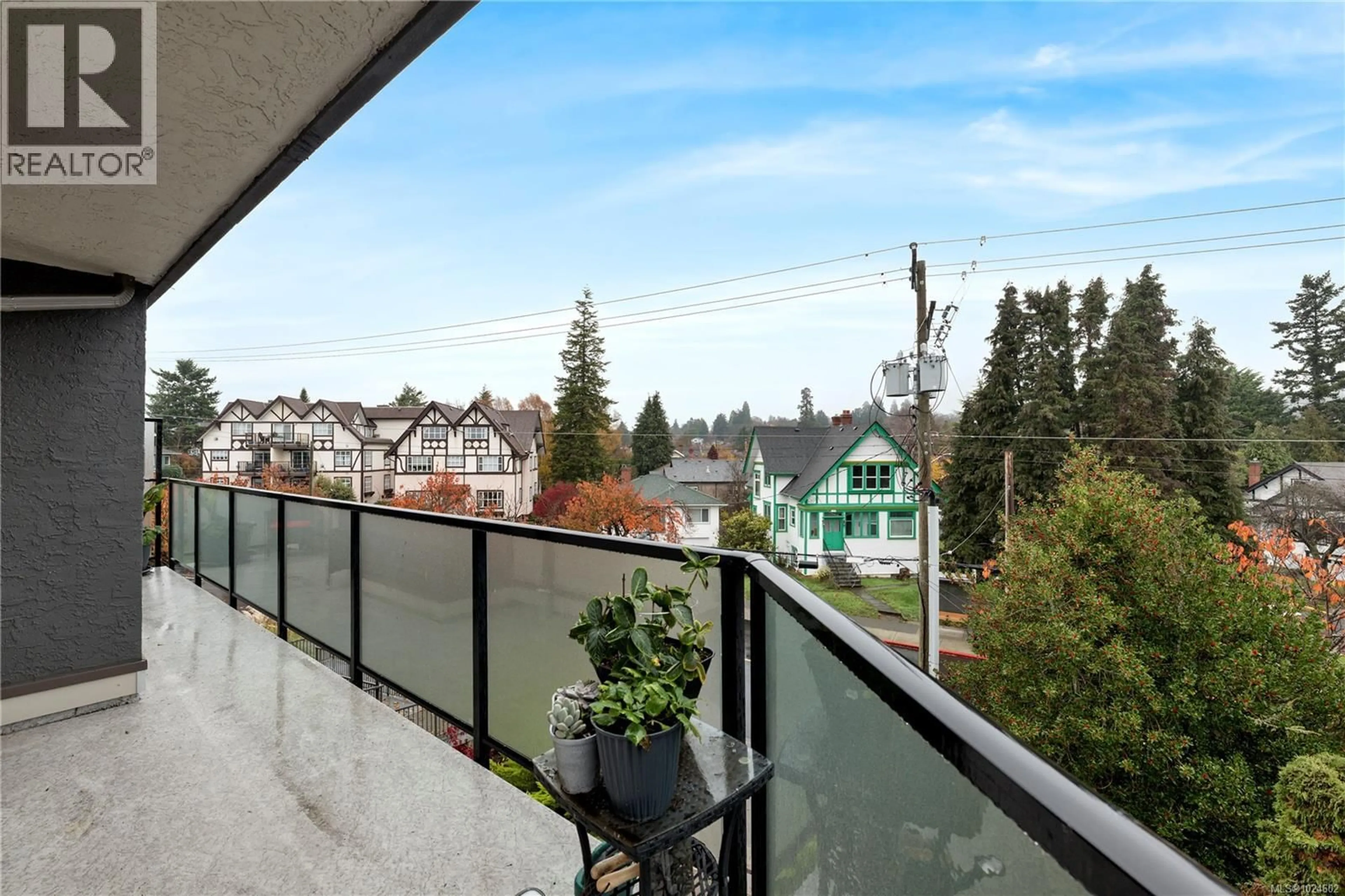 Balcony in the apartment, city buildings view from balcony for 402 - 1241 FAIRFIELD ROAD, Victoria British Columbia V8V3B3