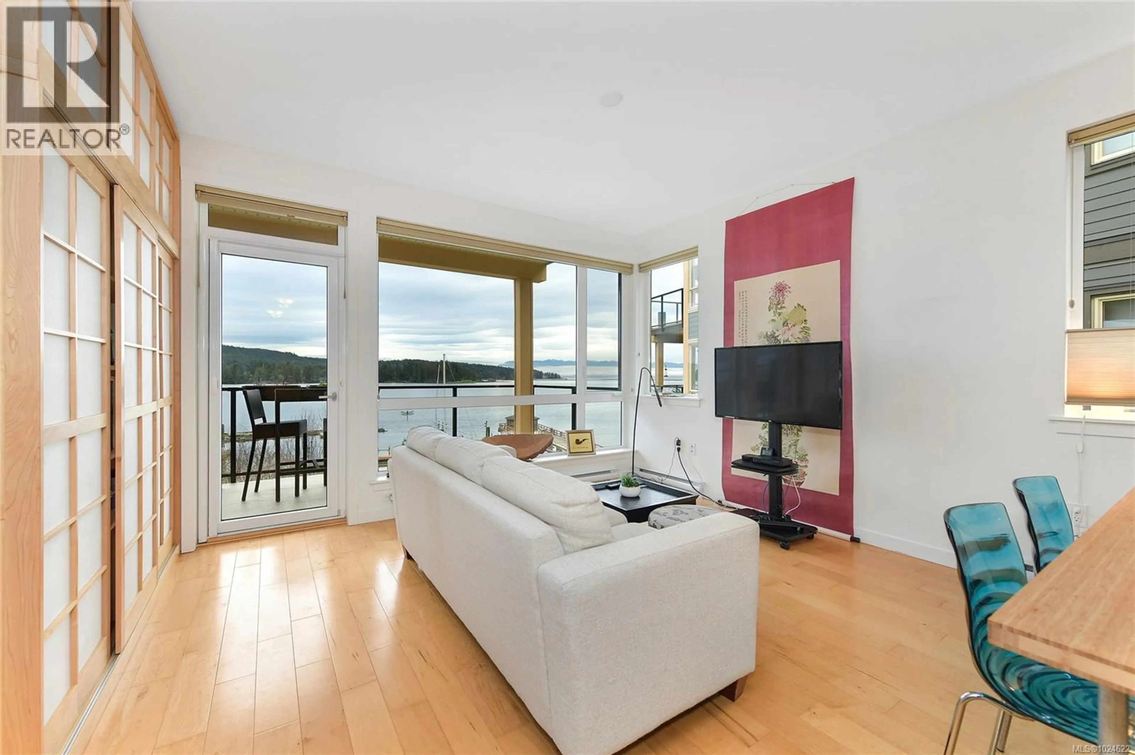 Living room with furniture, wood/laminate floor for 102 - 6671 HORNE ROAD, Sooke British Columbia V9Z0A2