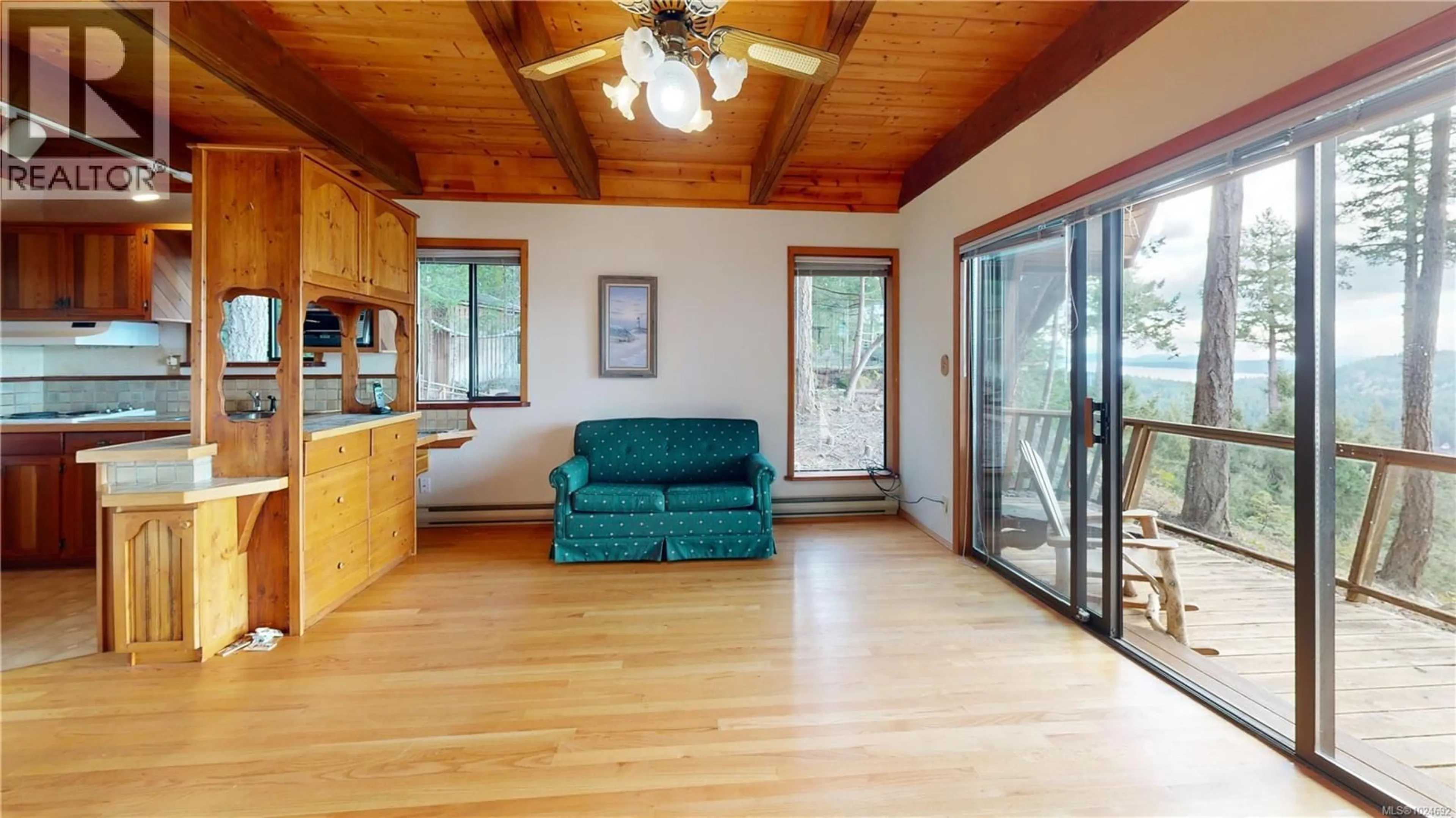 Living room with furniture, wood/laminate floor for 1095 COATS DRIVE, Gabriola Island British Columbia V0R1X4