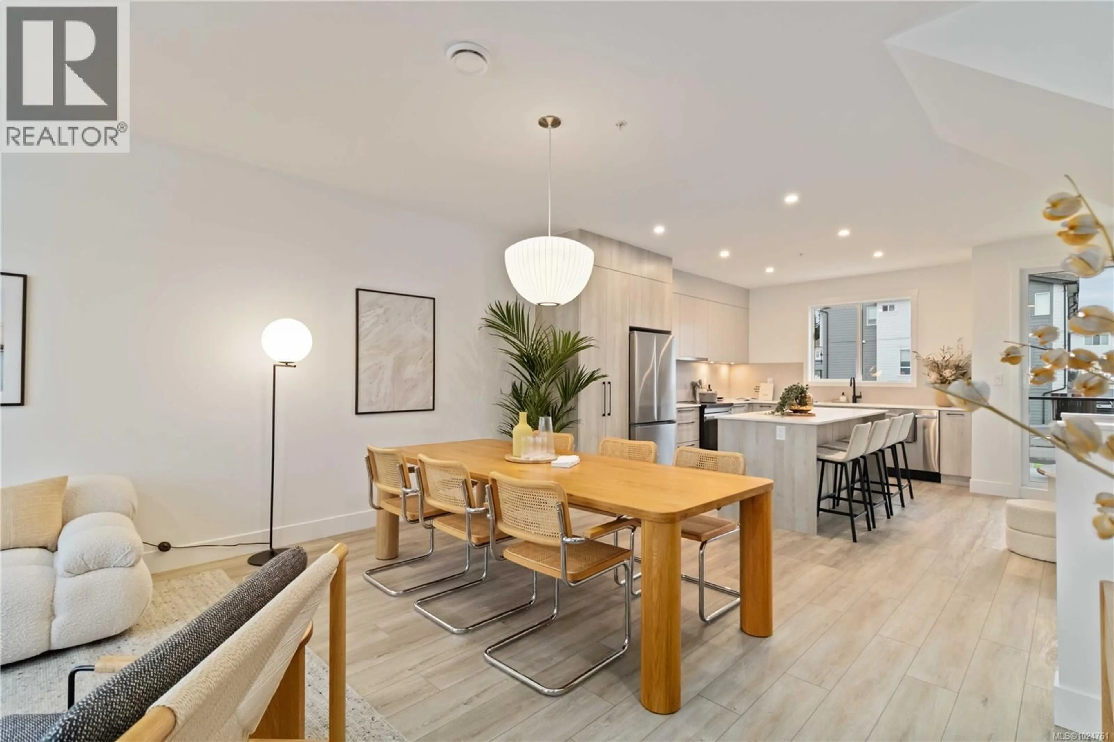 Open concept kitchen, wood/laminate floor for 107 - 368 TRADEWINDS AVENUE, Colwood British Columbia V9C0S5