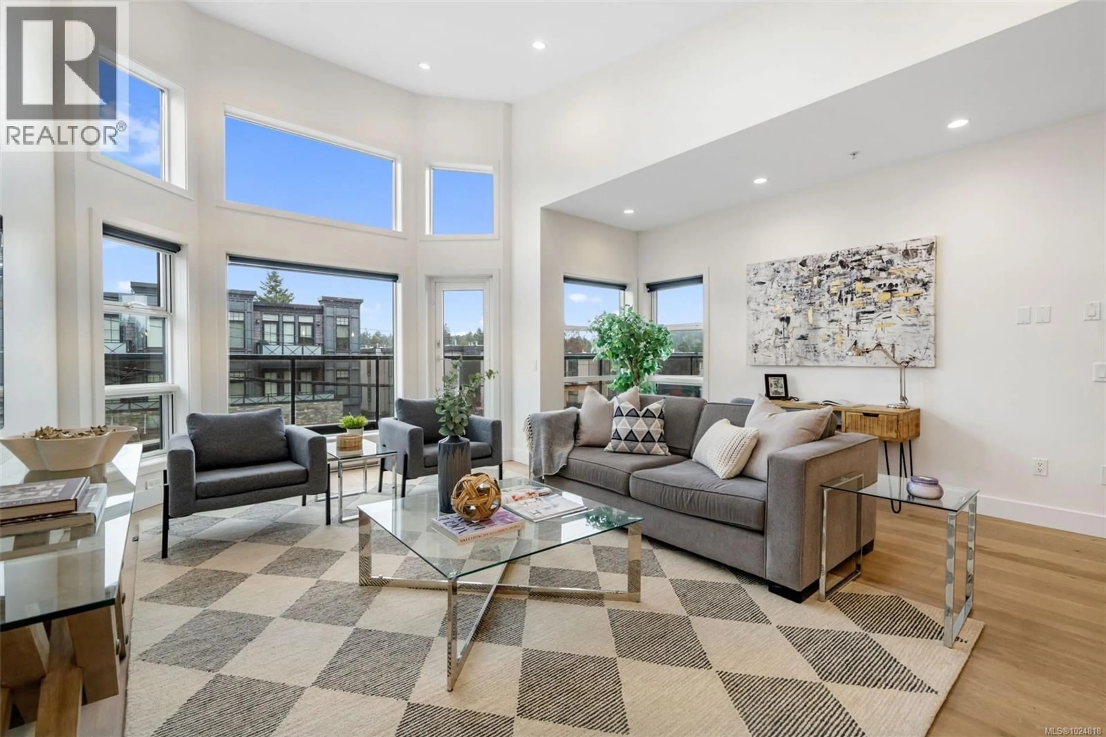 Living room with furniture, unknown for 301 - 2589 PENRHYN STREET, Saanich British Columbia V8N1G4