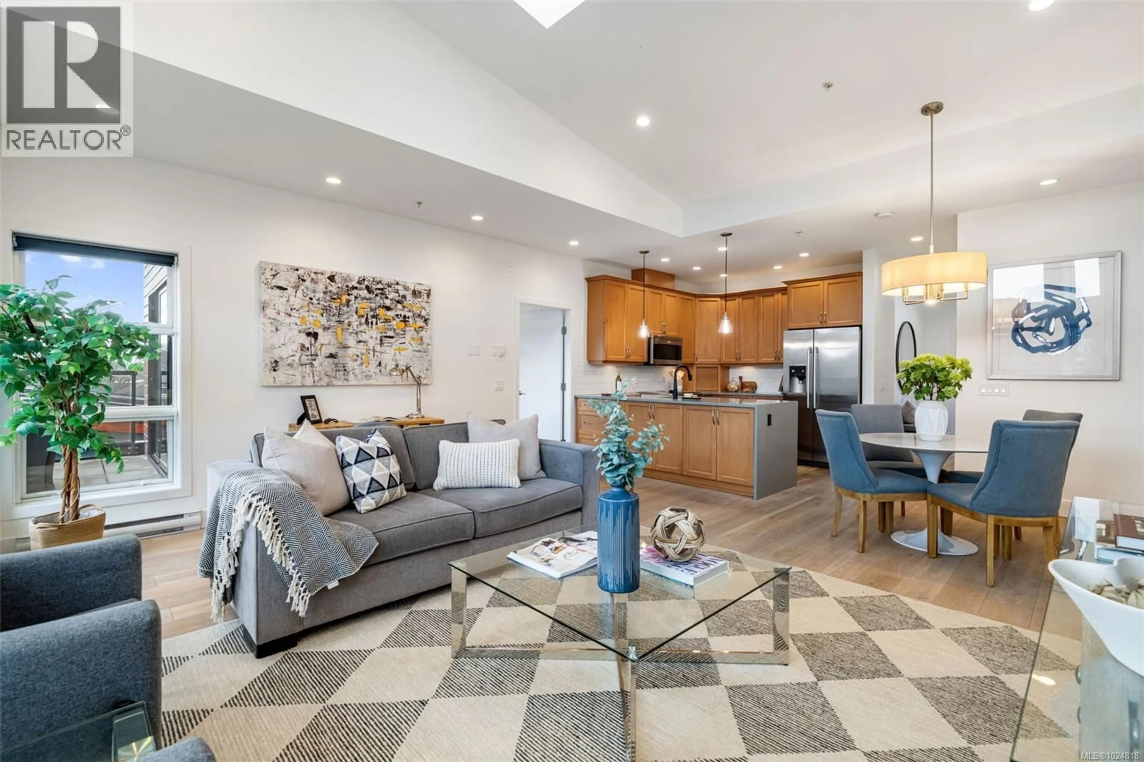 Open concept kitchen, ceramic/tile floor for 301 - 2589 PENRHYN STREET, Saanich British Columbia V8N1G4