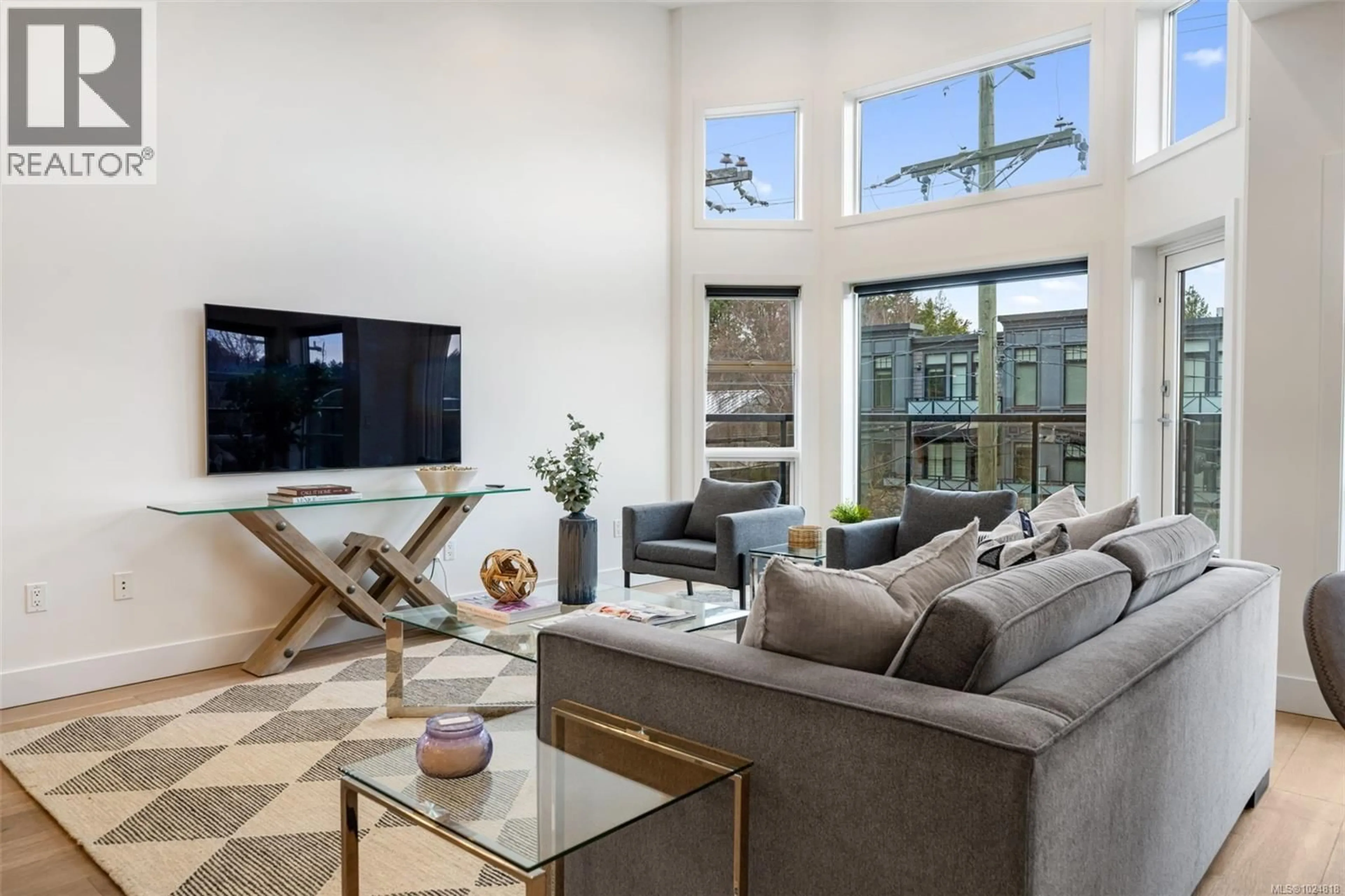 Living room with furniture, unknown for 301 - 2589 PENRHYN STREET, Saanich British Columbia V8N1G4