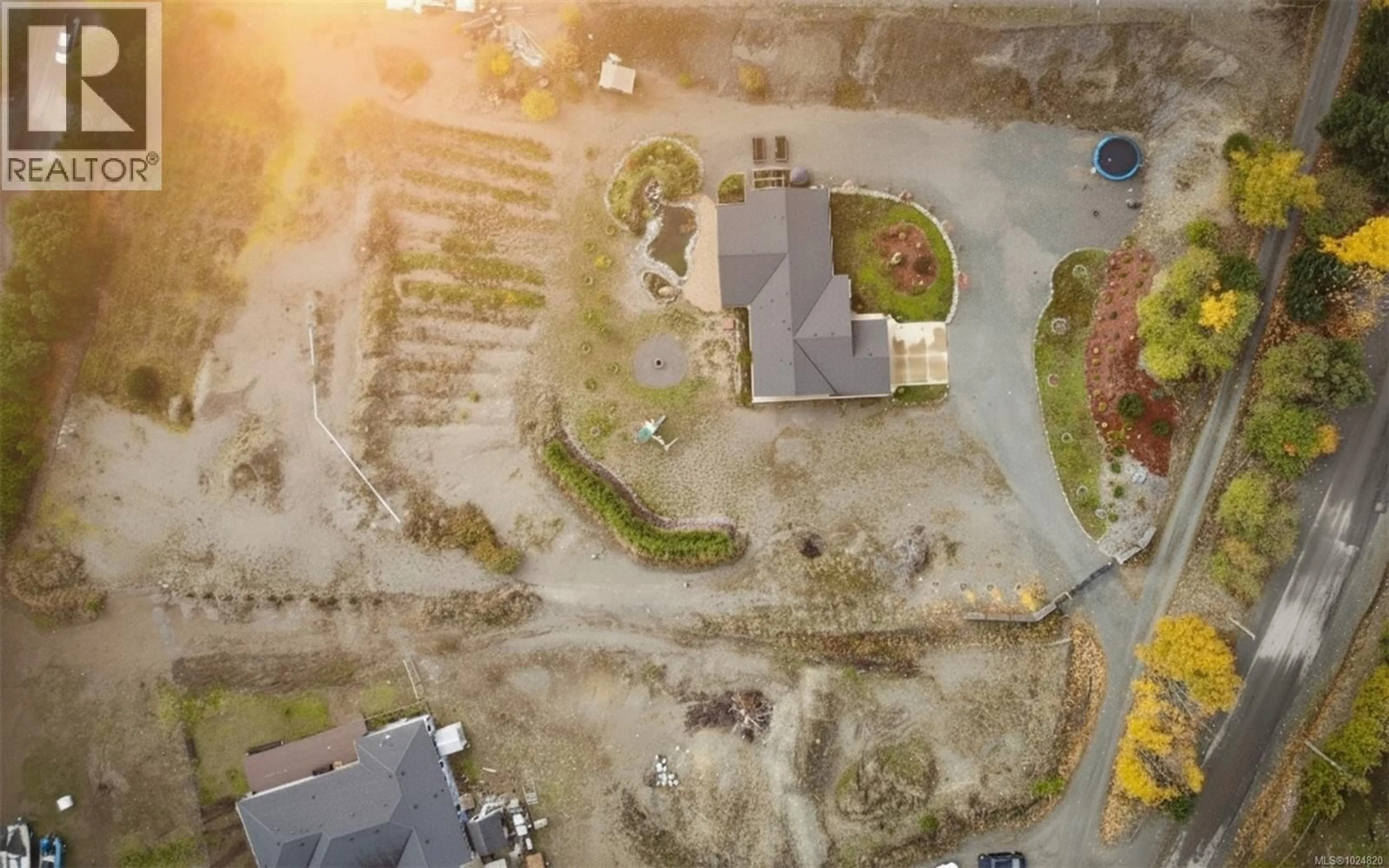 A pic from outside/outdoor area/front of a property/back of a property/a pic from drone, street for 1700 WARN WAY, Qualicum Beach British Columbia V9K2S3