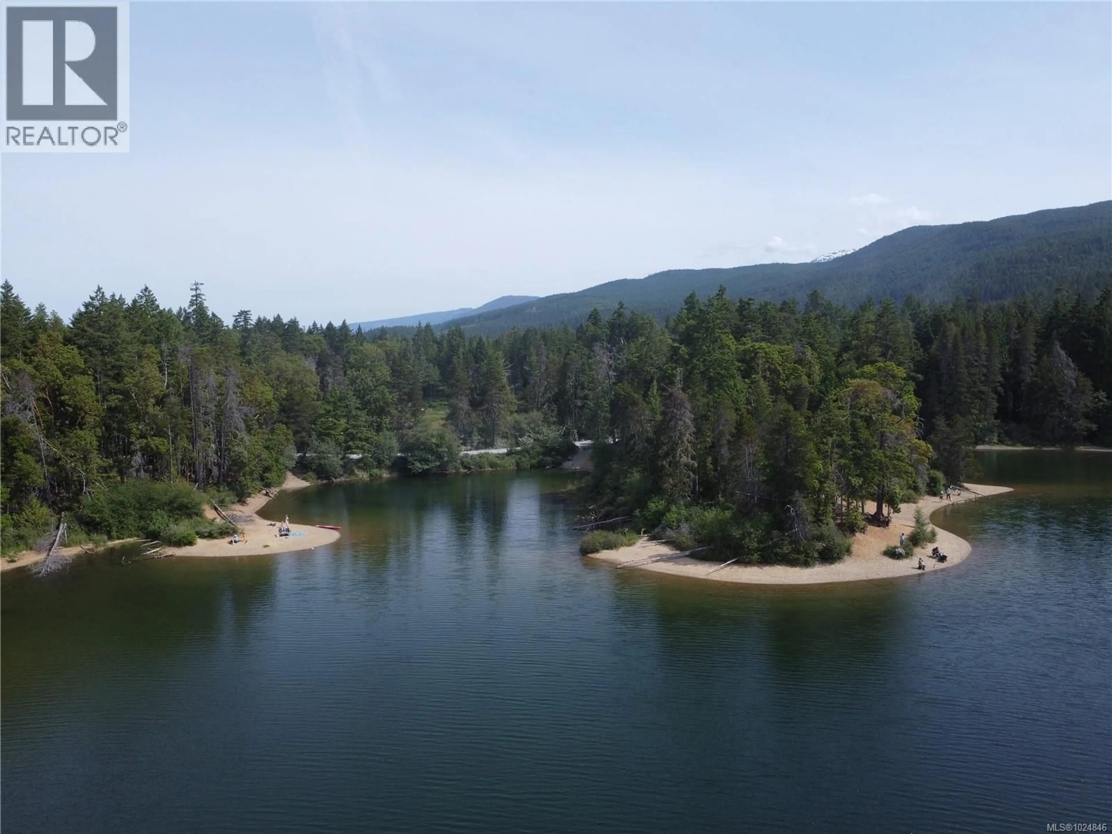 A pic from outside/outdoor area/front of a property/back of a property/a pic from drone, water/lake/river/ocean view for 1075 SPIDER LAKE ROAD, Qualicum Beach British Columbia V9K2L7
