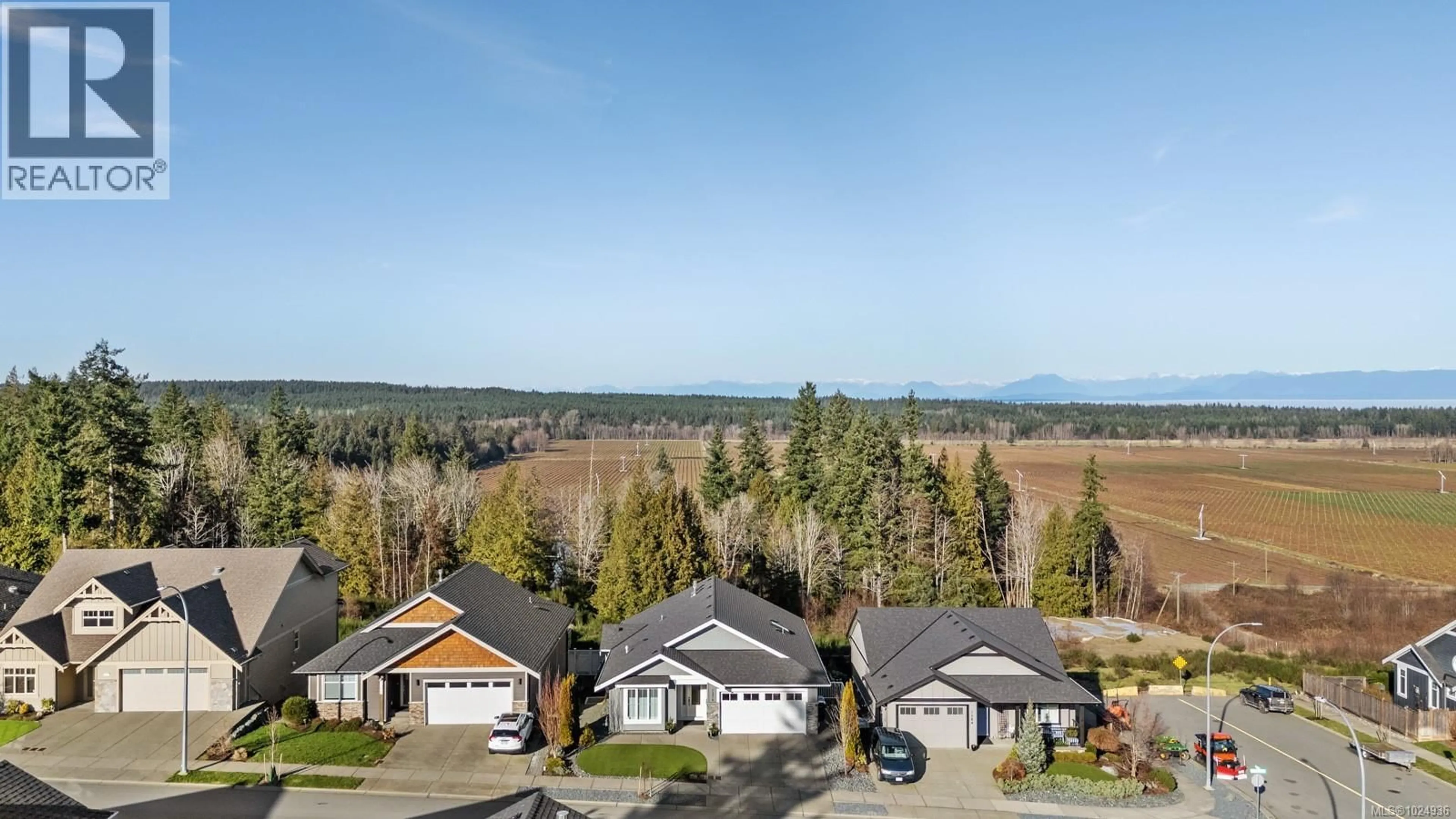 A pic from outside/outdoor area/front of a property/back of a property/a pic from drone, mountain view for 1376 CROWN ISLE BOULEVARD, Courtenay British Columbia V9N0E2