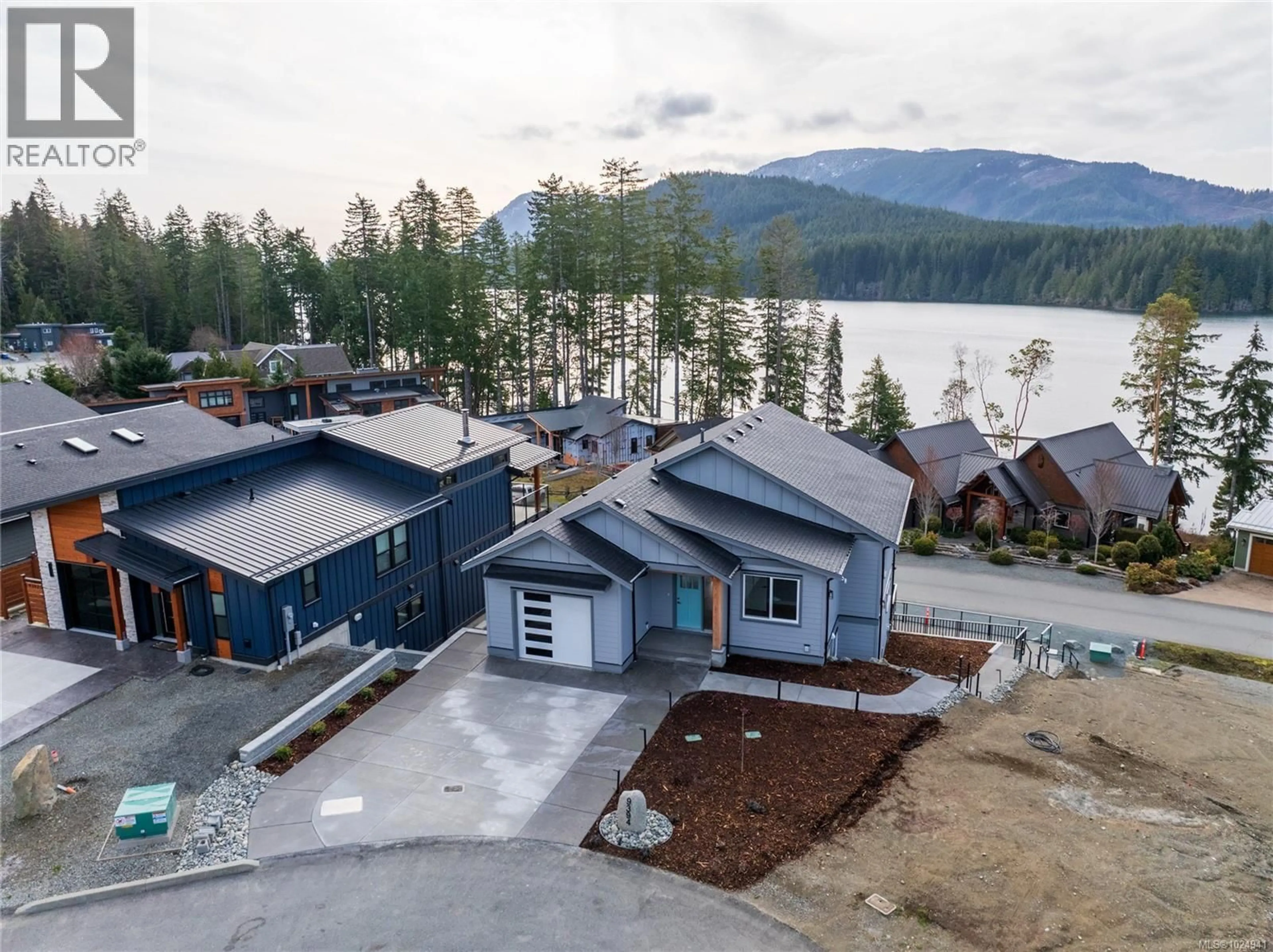 A pic from outside/outdoor area/front of a property/back of a property/a pic from drone, water/lake/river/ocean view for 9394 LAKEFRONT RISE, Lake Cowichan British Columbia V0R2G0