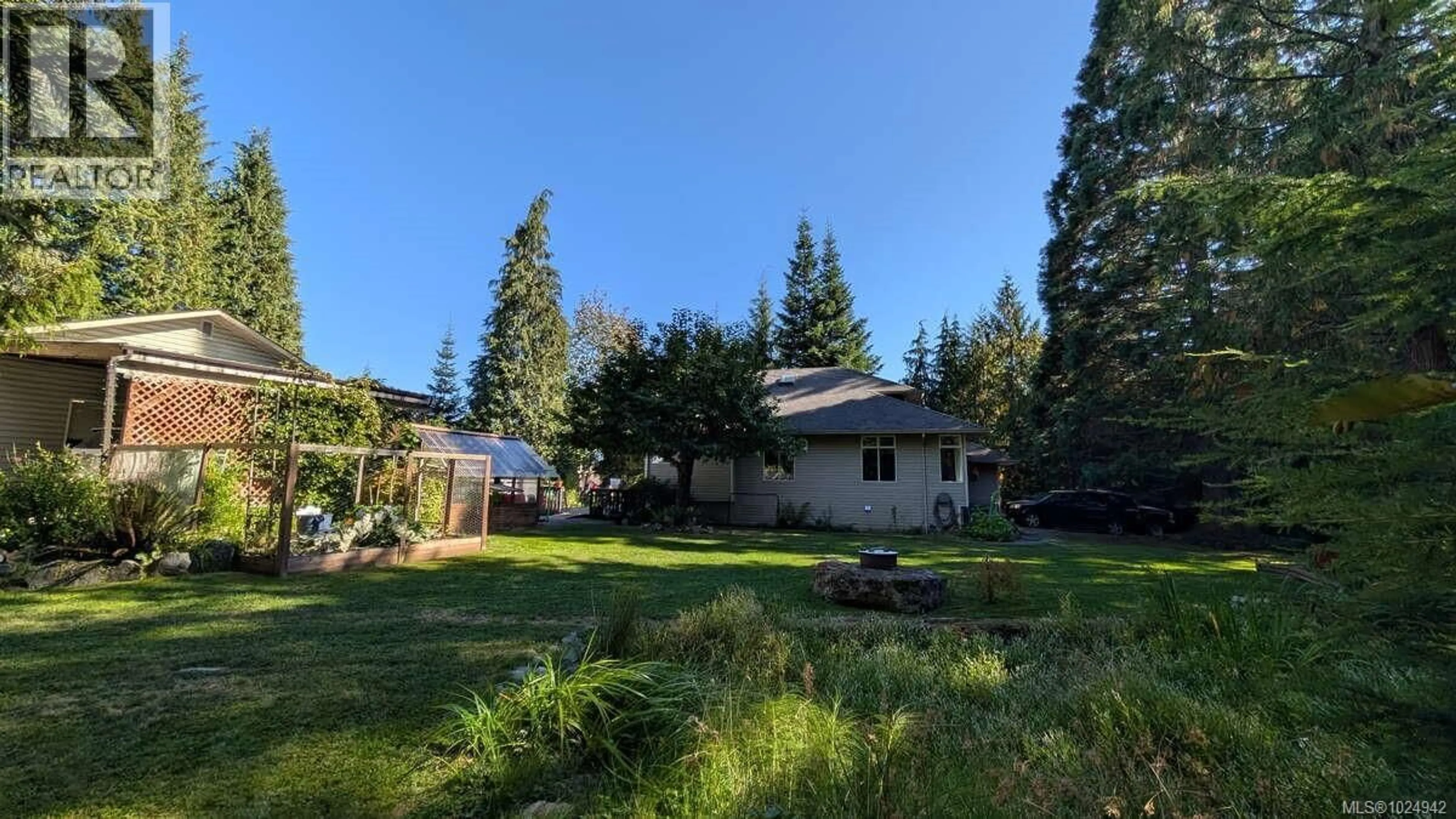 A pic from outside/outdoor area/front of a property/back of a property/a pic from drone, forest/trees view for 100 ELK ROAD, Lake Cowichan British Columbia V0R2G0