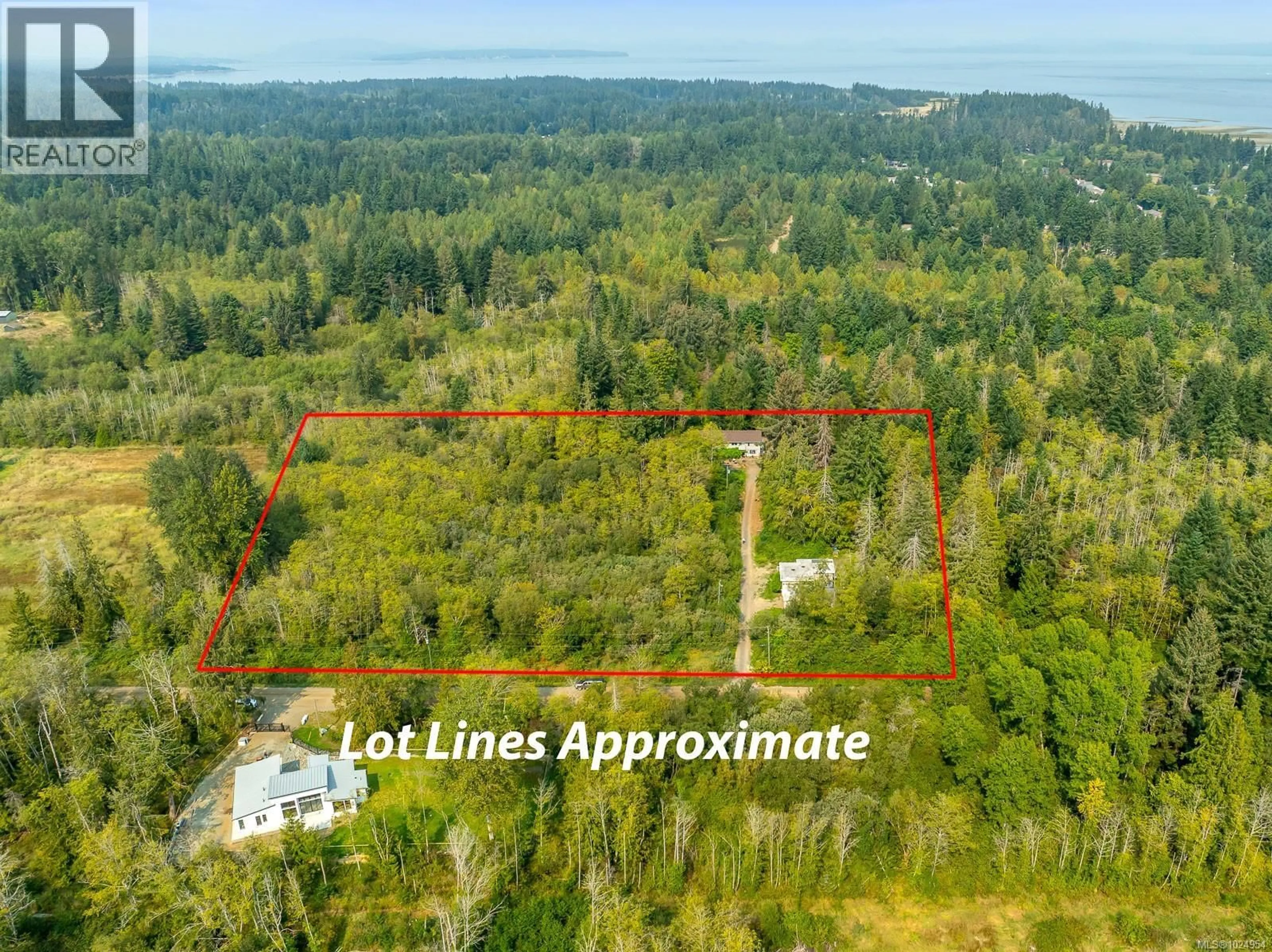 A pic from outside/outdoor area/front of a property/back of a property/a pic from drone, forest/trees view for 2180 SCHULZ ROAD, Black Creek British Columbia V9J1K5