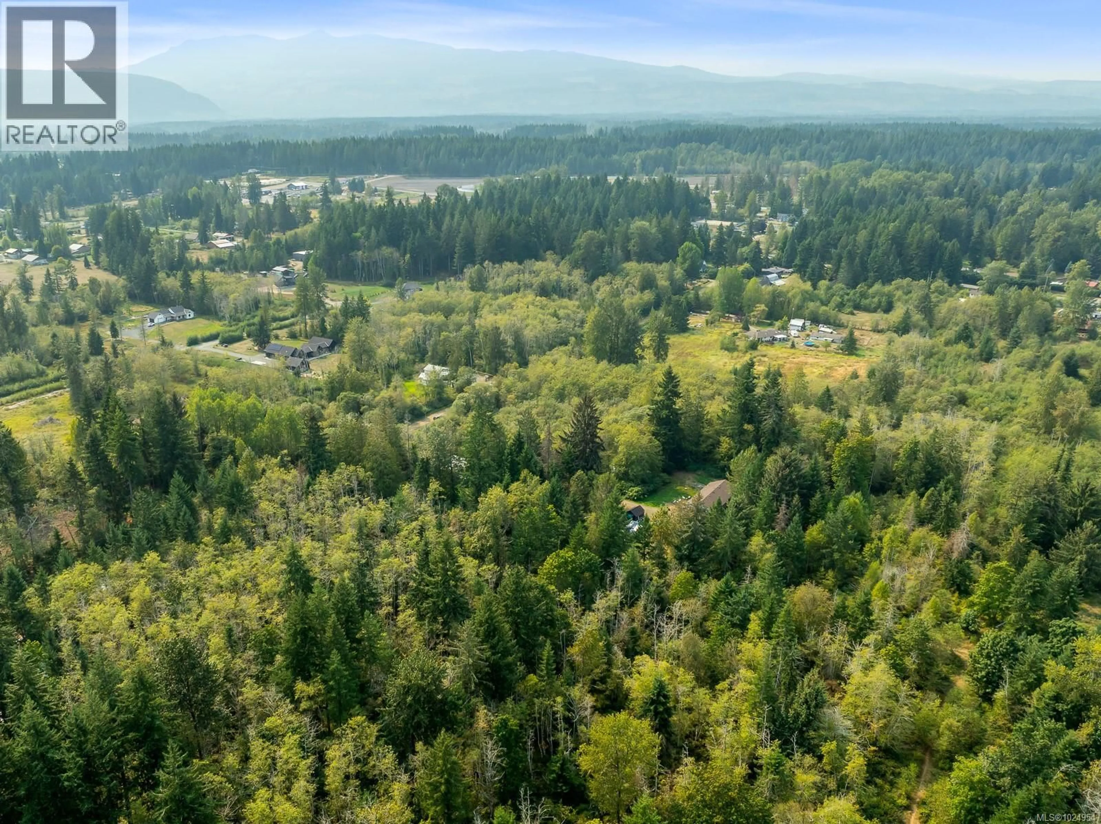 A pic from outside/outdoor area/front of a property/back of a property/a pic from drone, forest/trees view for 2180 SCHULZ ROAD, Black Creek British Columbia V9J1K5