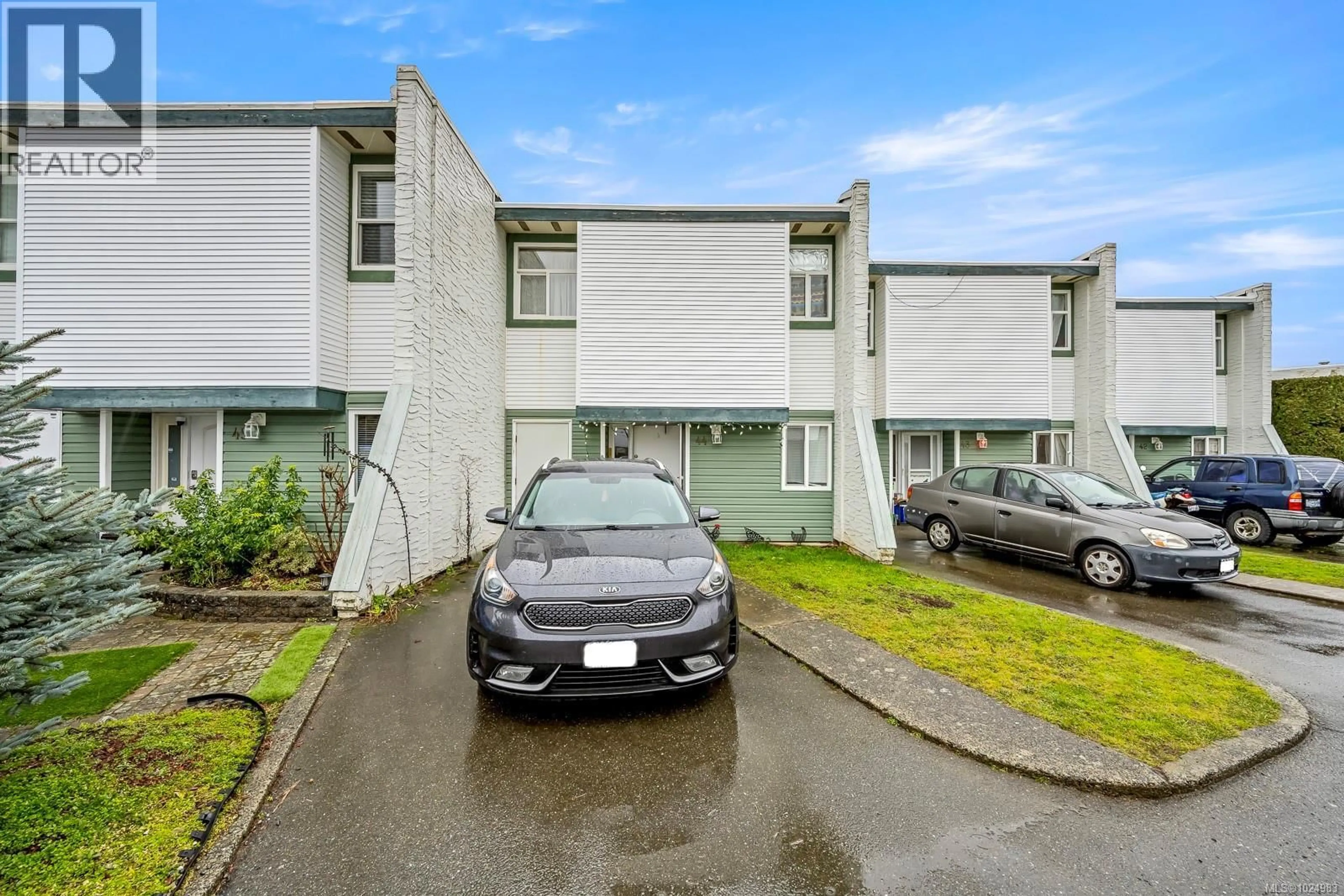 A pic from outside/outdoor area/front of a property/back of a property/a pic from drone, street for 44 - 1957 GUTHRIE ROAD, Comox British Columbia V9M2J2