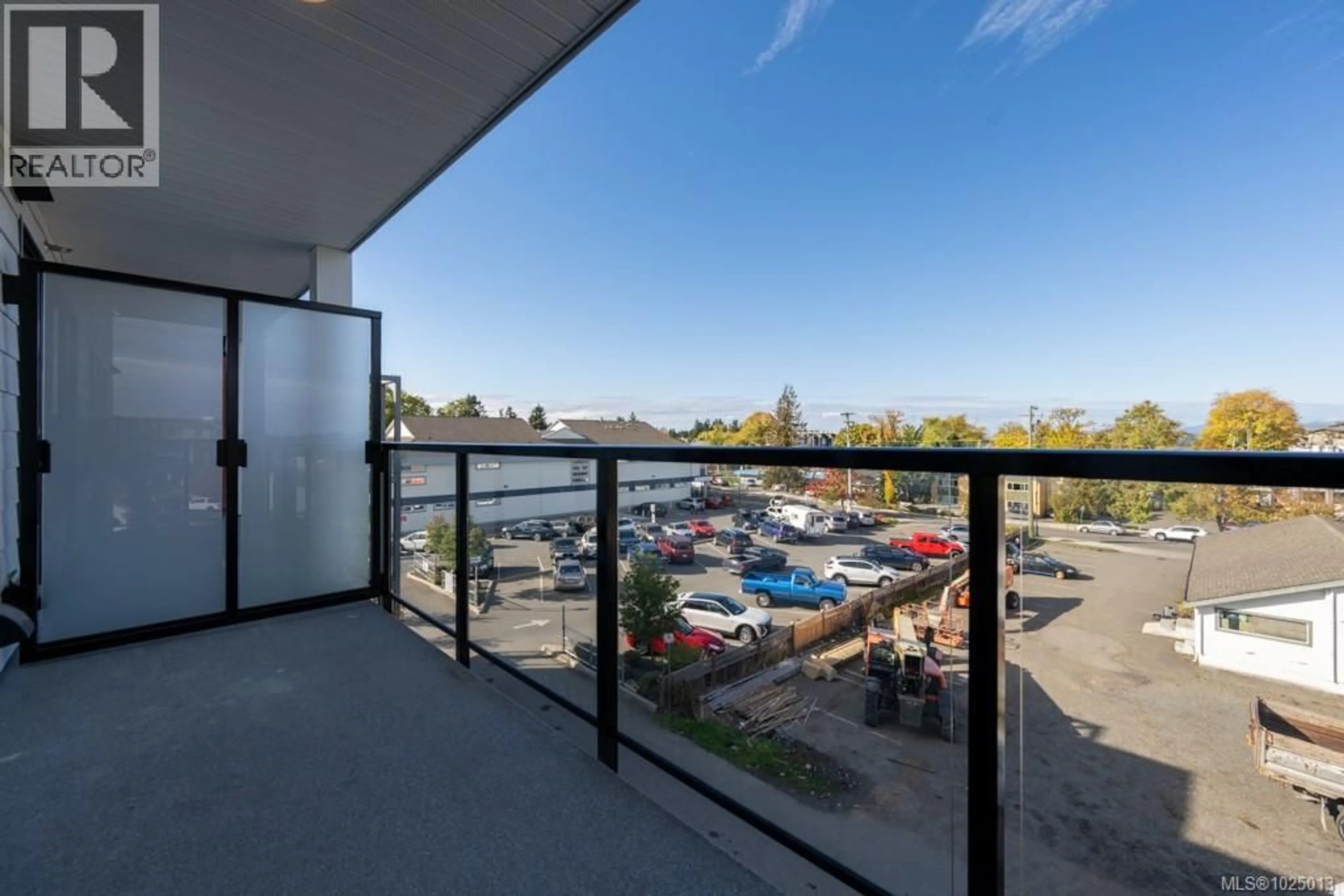 Balcony in the apartment, city buildings view from balcony for 202 - 171 JENSEN AVENUE WEST, Parksville British Columbia V9P1K3