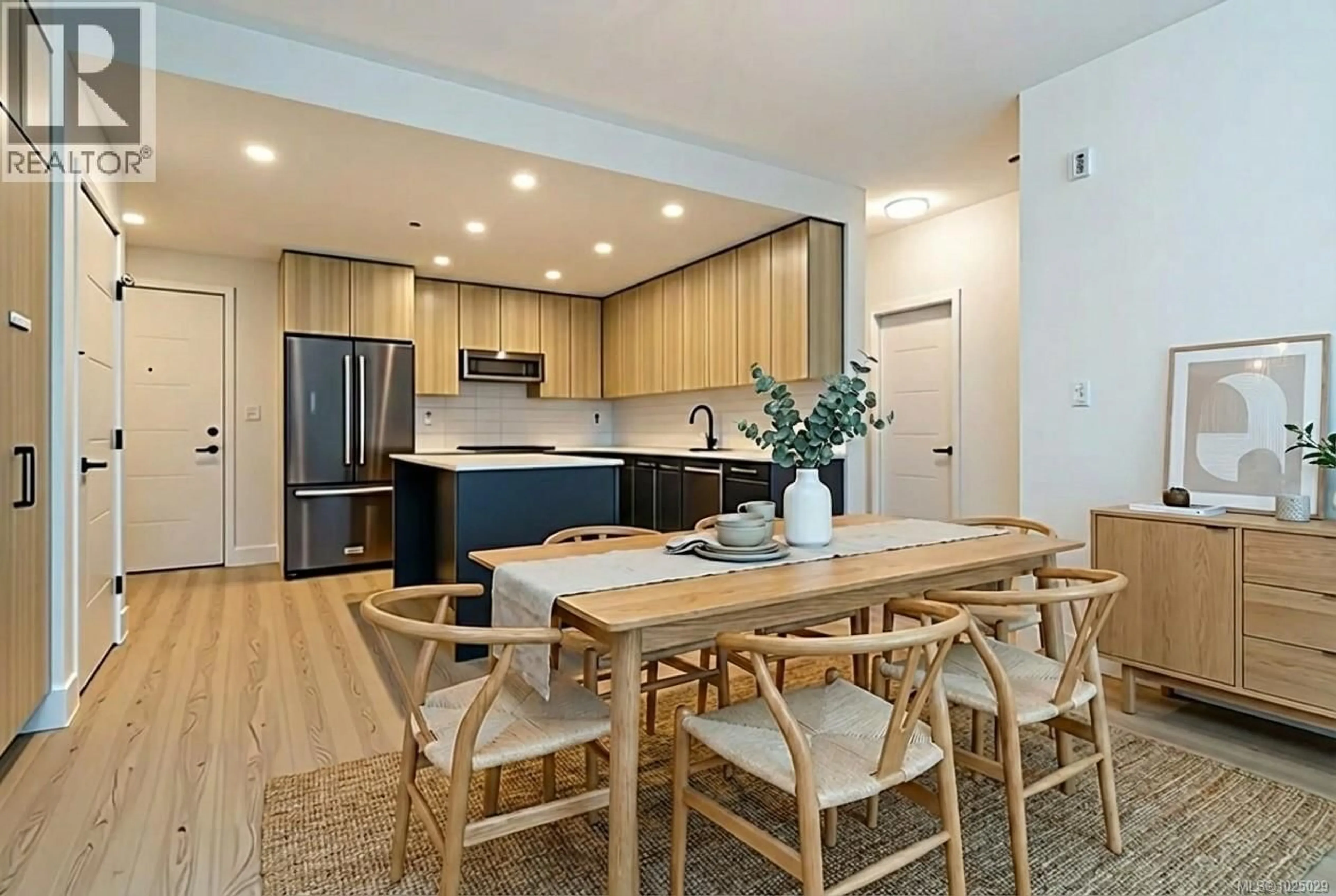 Open concept kitchen, wood/laminate floor for 221 - 920 REUNION AVENUE, Langford British Columbia V9B0W8