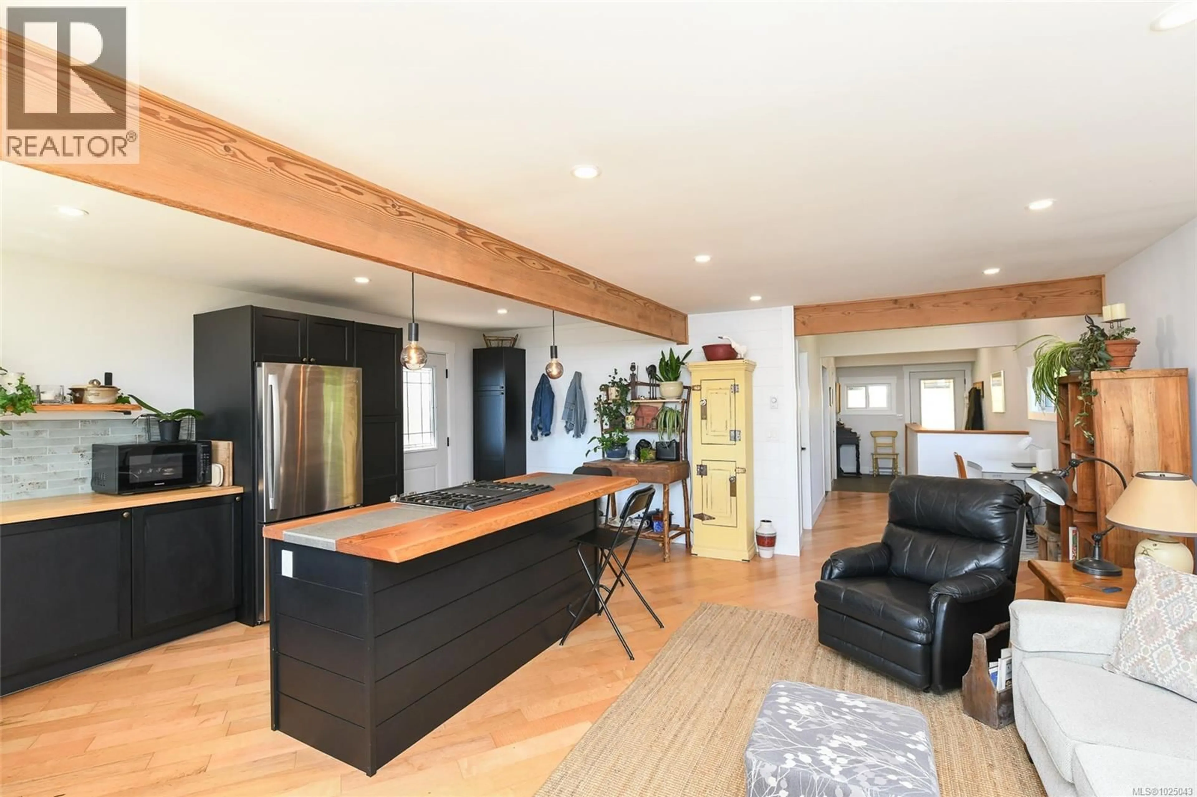 Open concept kitchen, wood/laminate floor for 5693 ISLAND HIGHWAY SOUTH, Union Bay British Columbia V0R3B0