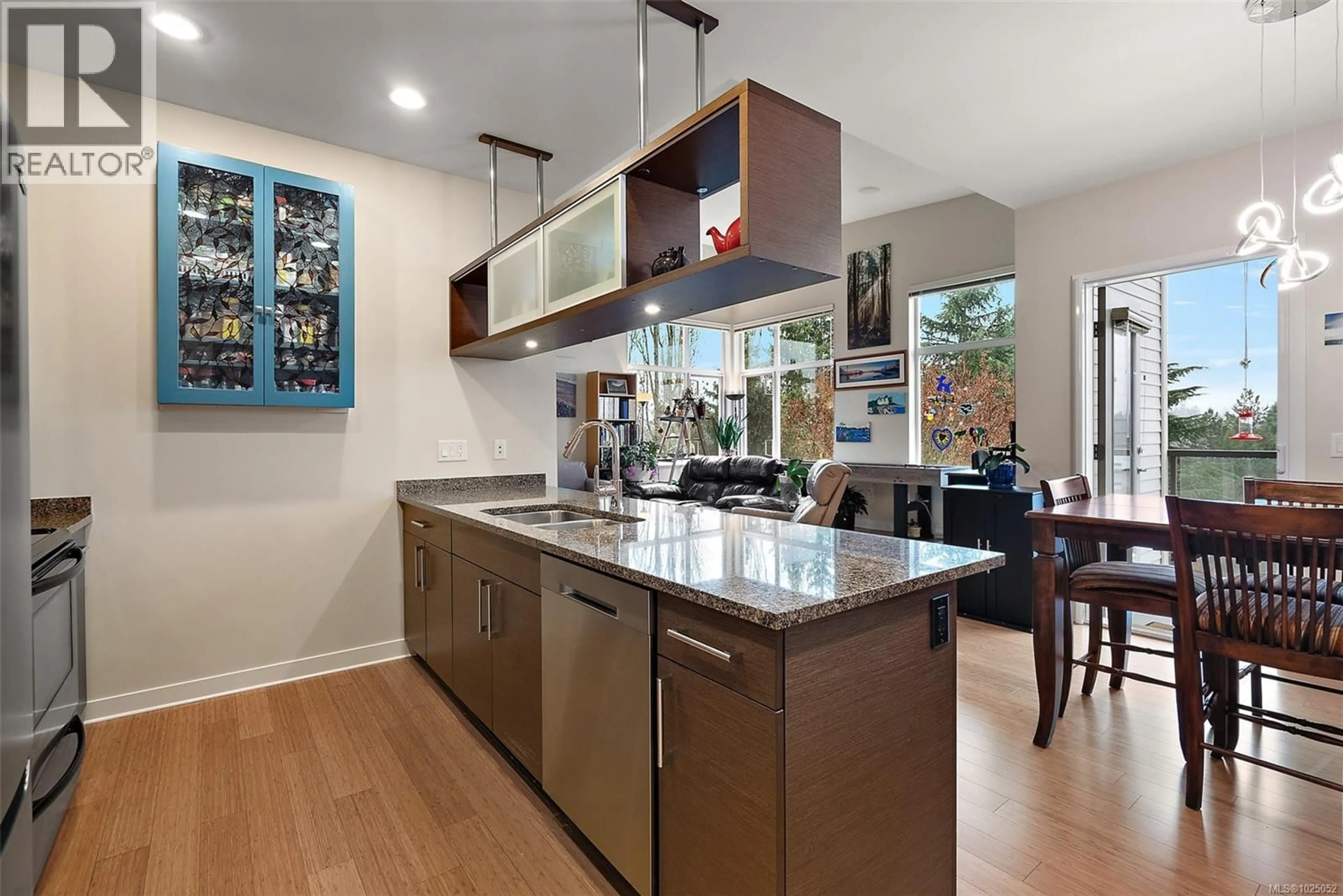 Contemporary kitchen, ceramic/tile floor for 404 - 4394 WEST SAANICH ROAD, Saanich British Columbia V8Z0B5