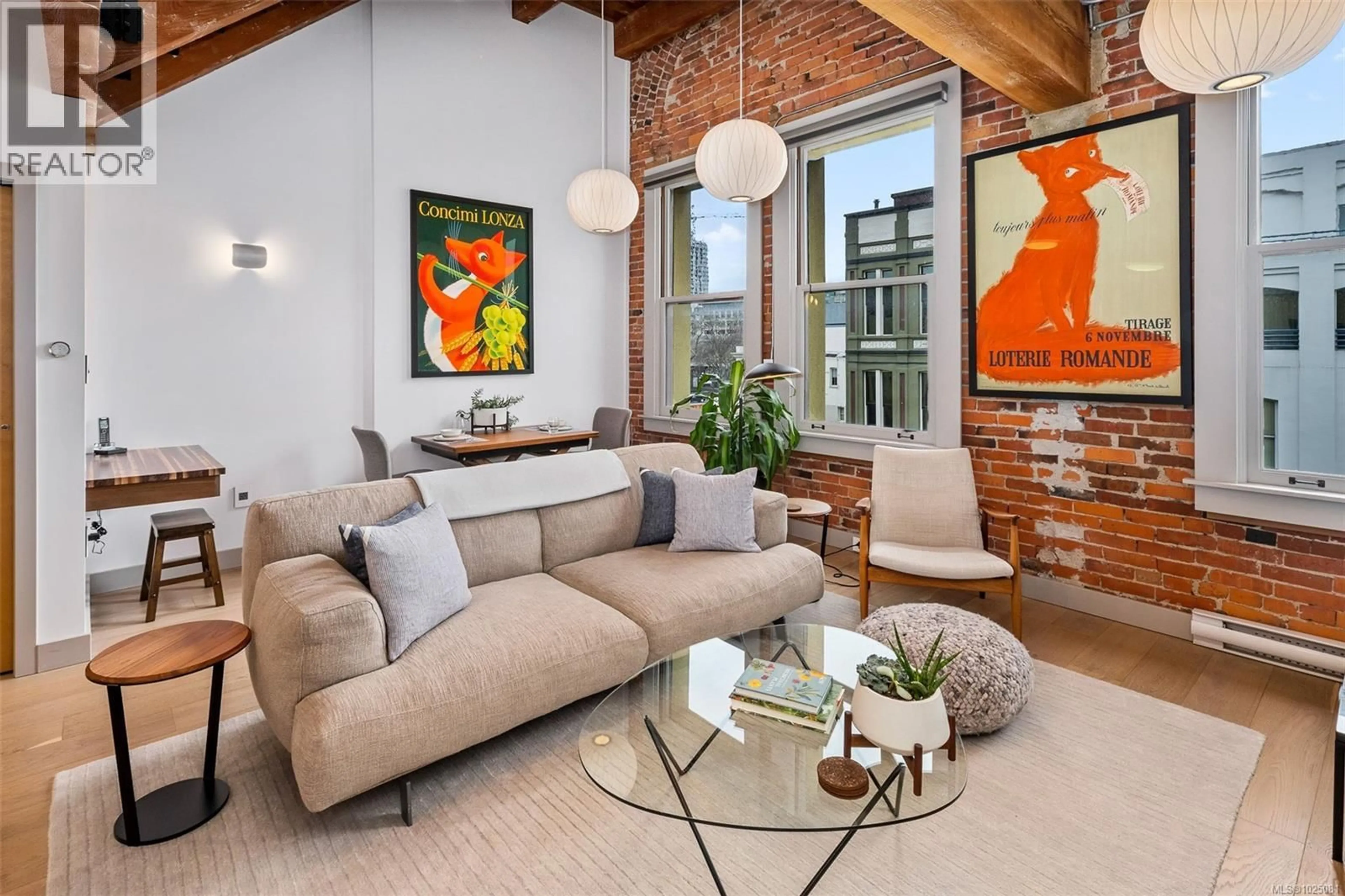 Living room with furniture, cement floor for 317 - 599 PANDORA AVENUE, Victoria British Columbia V8W1N5