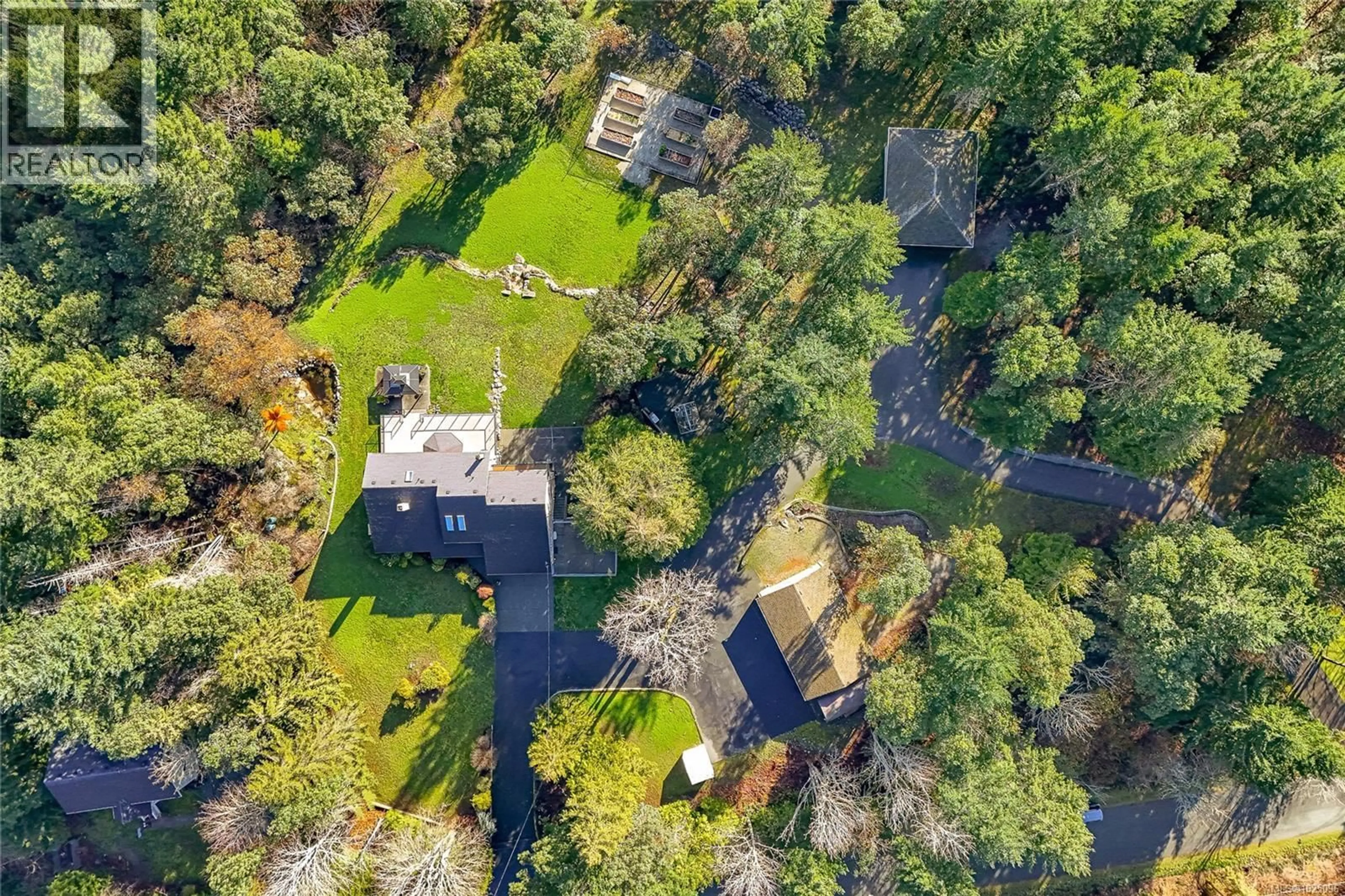 A pic from outside/outdoor area/front of a property/back of a property/a pic from drone, forest/trees view for 8273 THOMSON PLACE, Central Saanich British Columbia V8M1T6