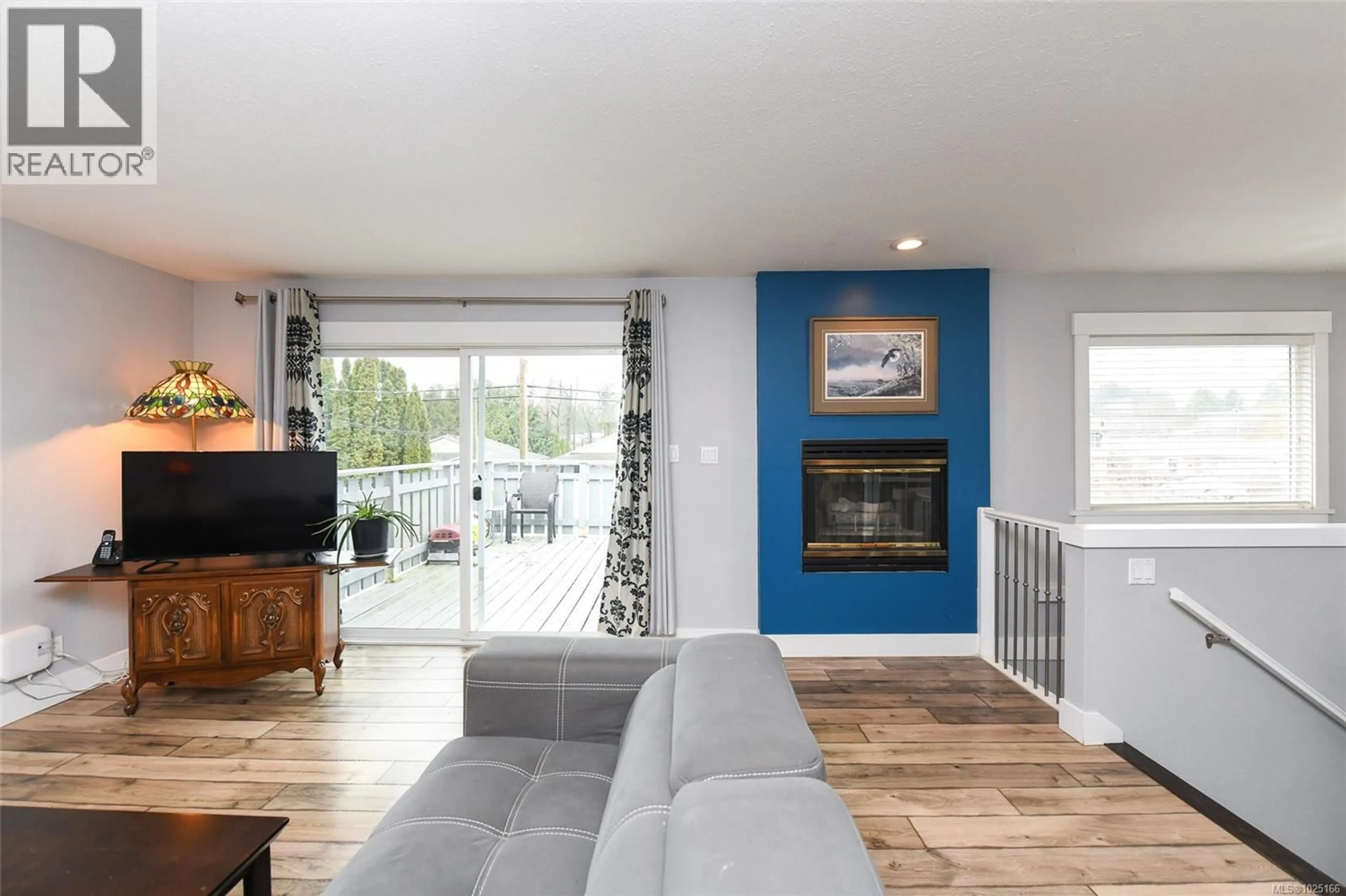 Living room with furniture, wood/laminate floor for 2350B WILLEMAR AVENUE, Courtenay British Columbia V9N3M8