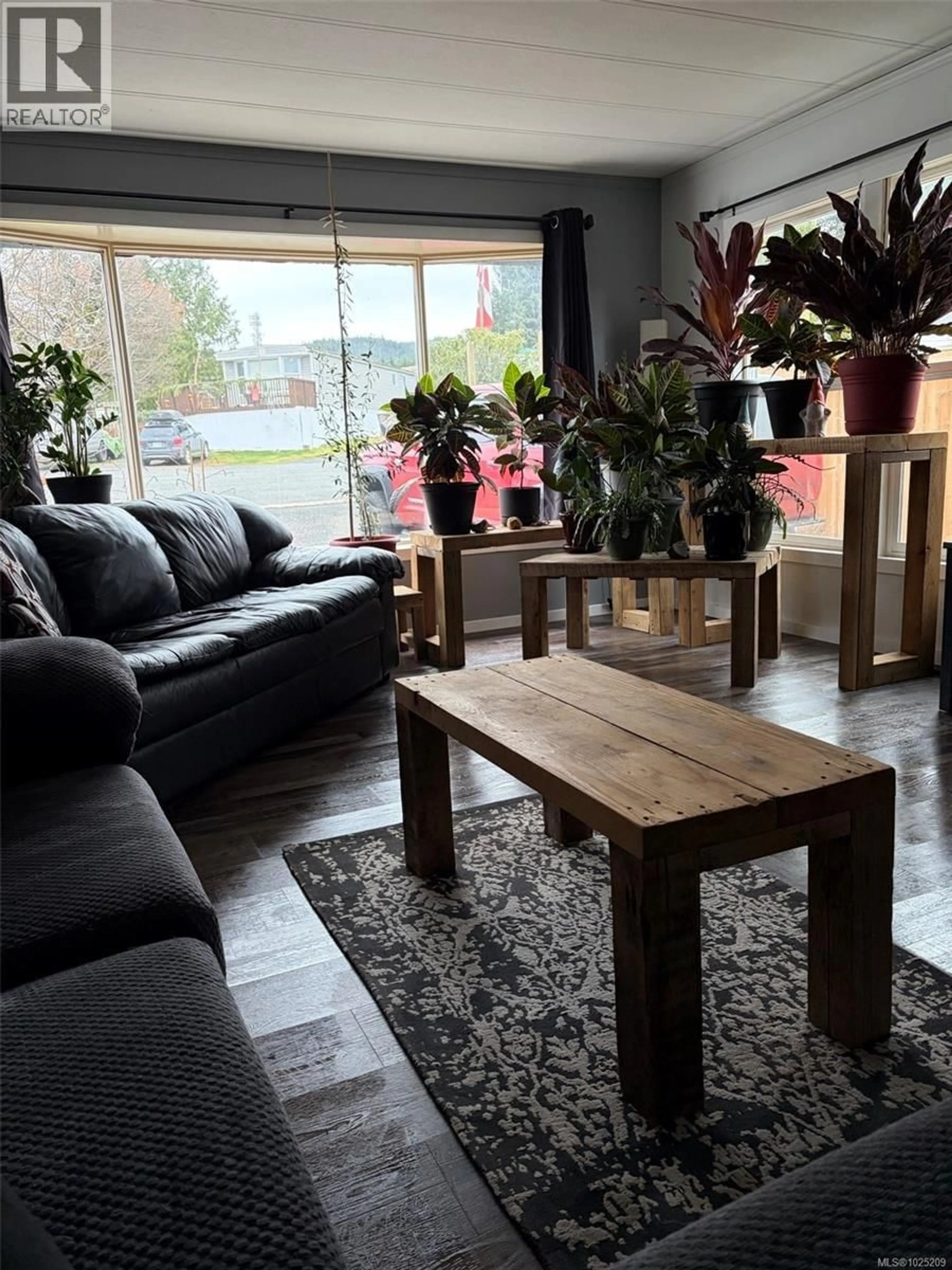 Living room with furniture, wood/laminate floor for 9446 CHANCELLOR HEIGHTS, Port Hardy British Columbia V0N2P0