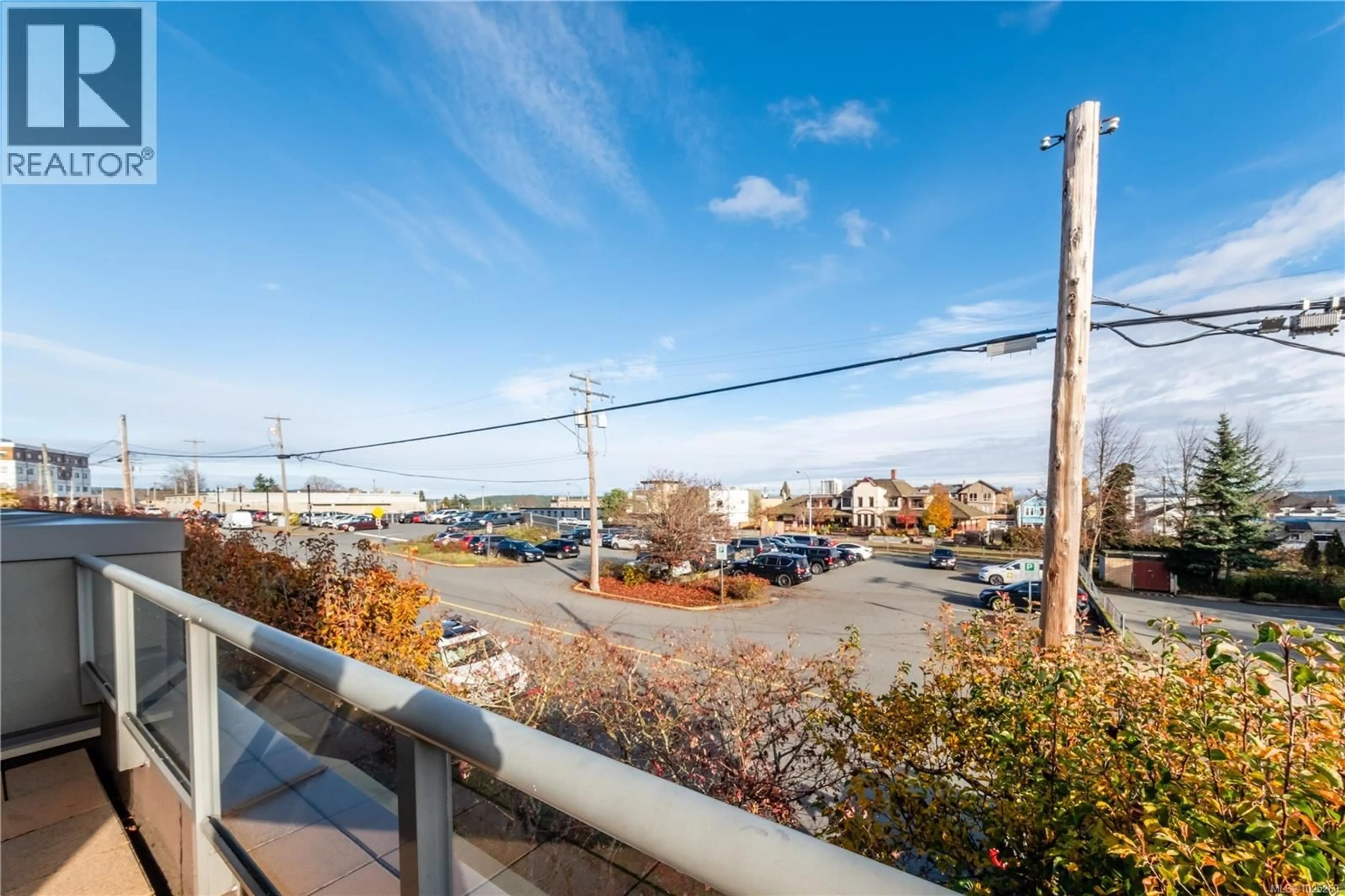 Patio, city buildings view from balcony for 201 - 327 PRIDEAUX STREET, Nanaimo British Columbia V9R2N4