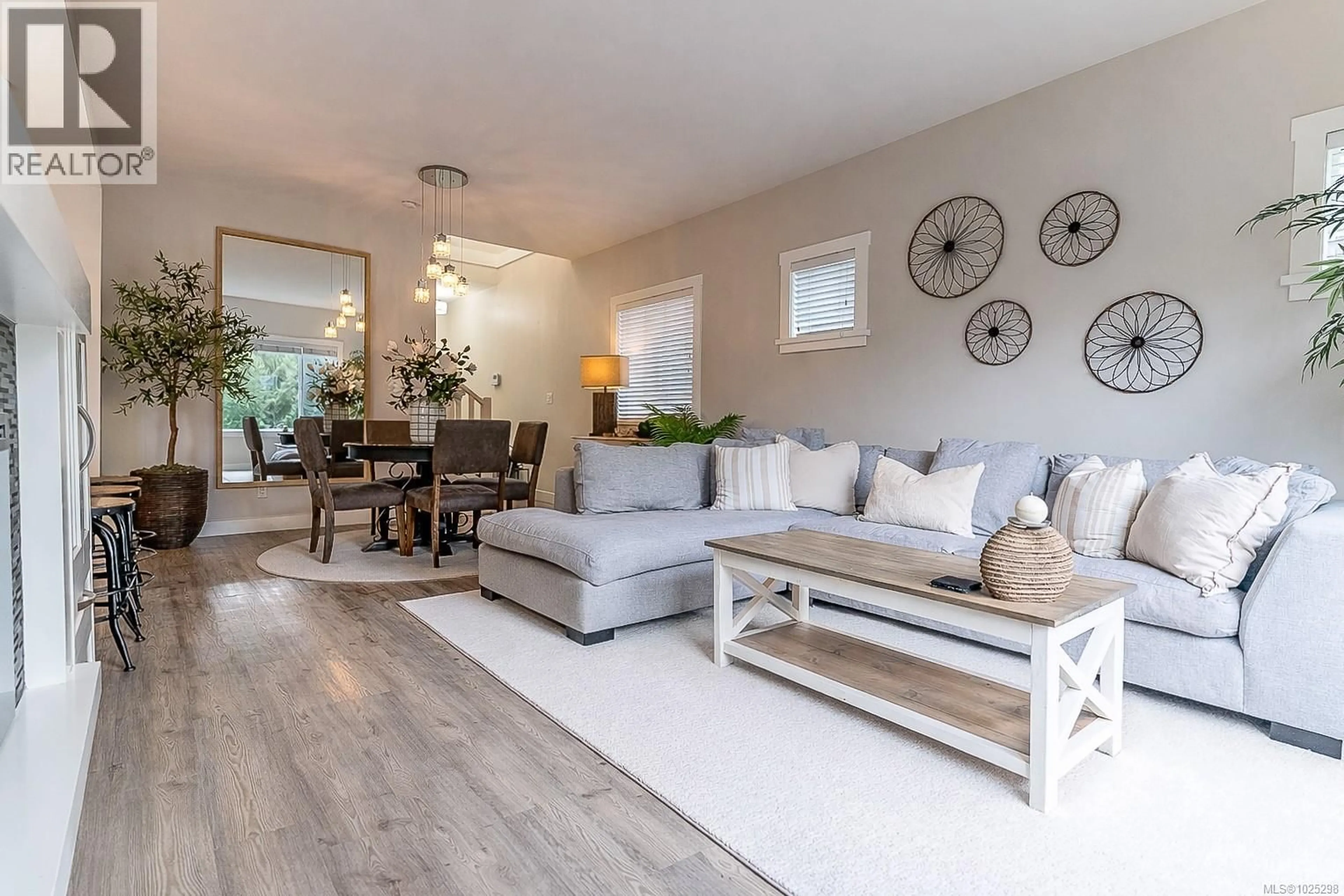 Living room with furniture, wood/laminate floor for 3004 DORNIER ROAD, Langford British Columbia V9B0A5
