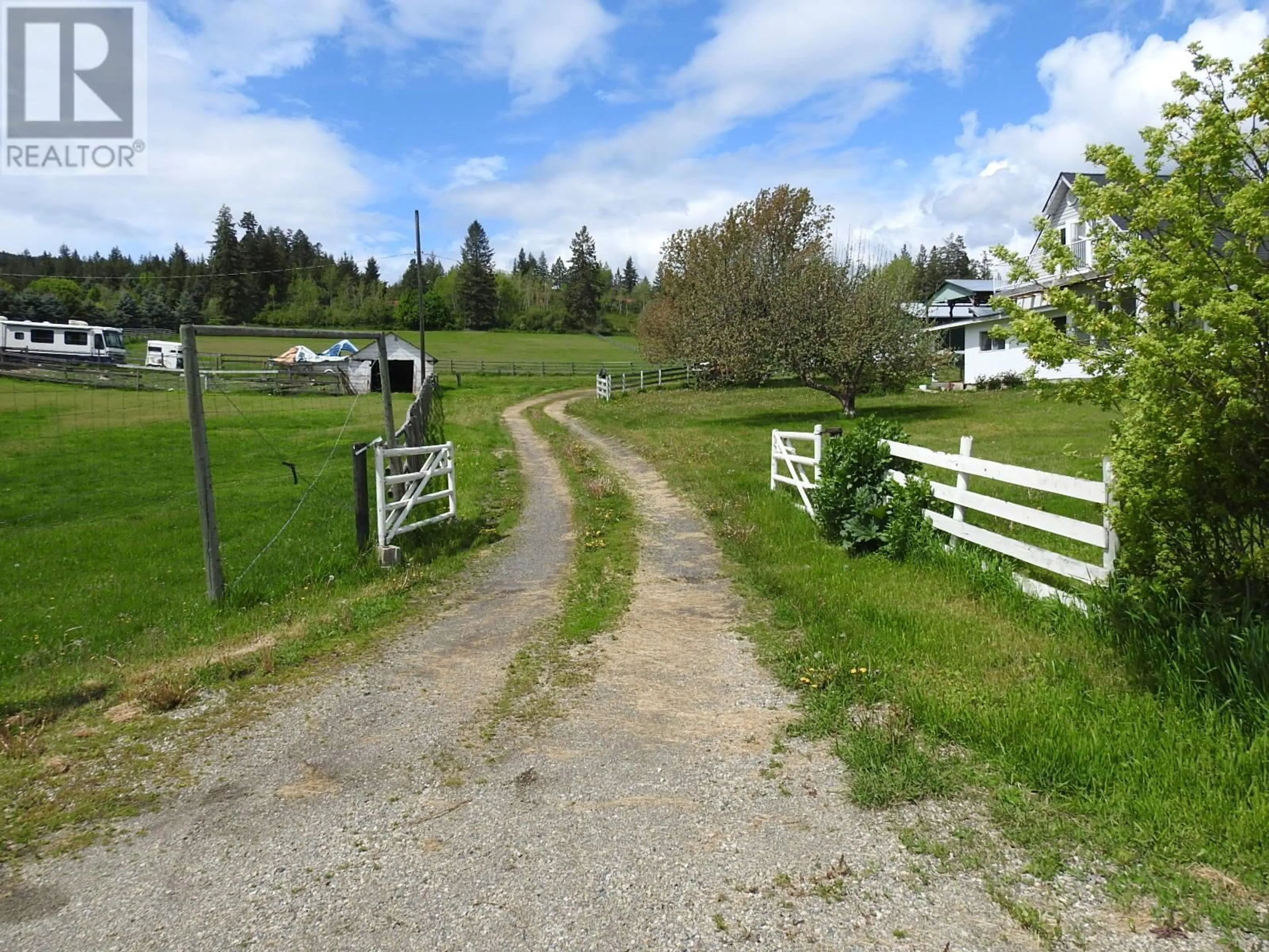 A pic from outside/outdoor area/front of a property/back of a property/a pic from drone, street for 4435 HALLAM ROAD, Armstrong British Columbia V0E1B0