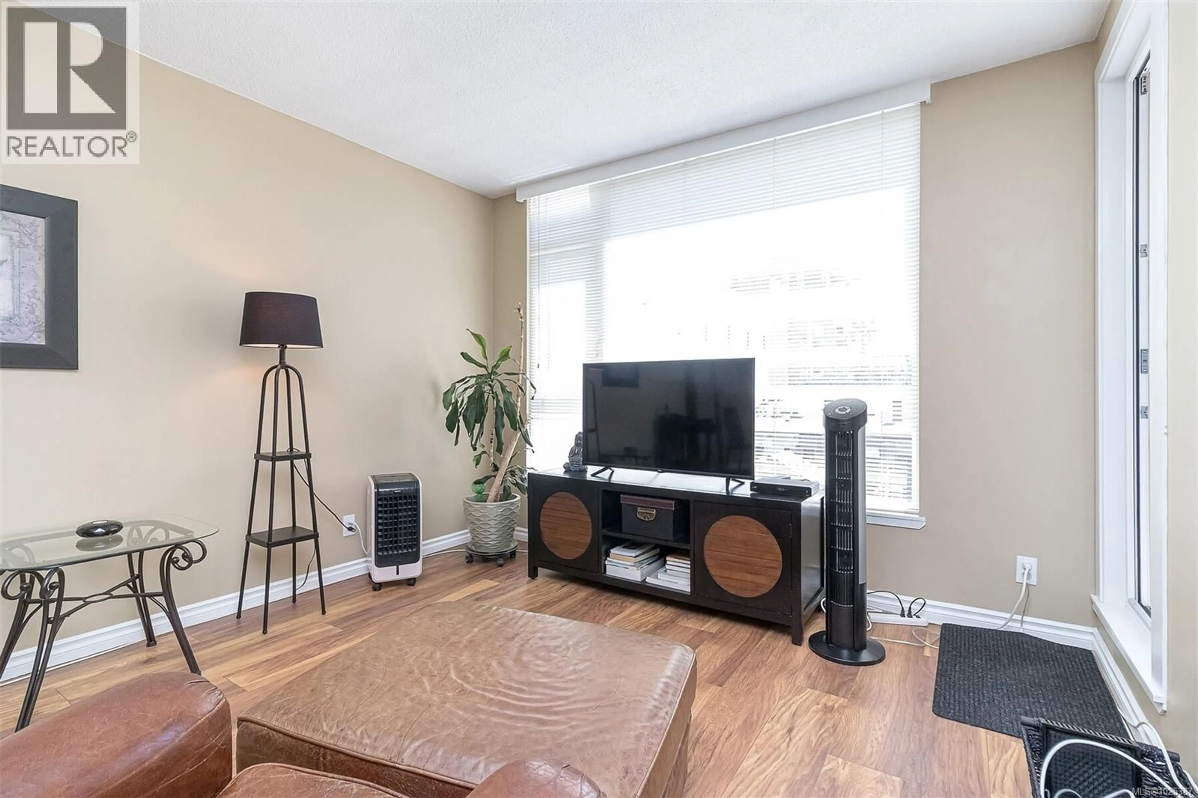 Living room with furniture, wood/laminate floor for 308 - 835 VIEW STREET, Victoria British Columbia V8W3W8