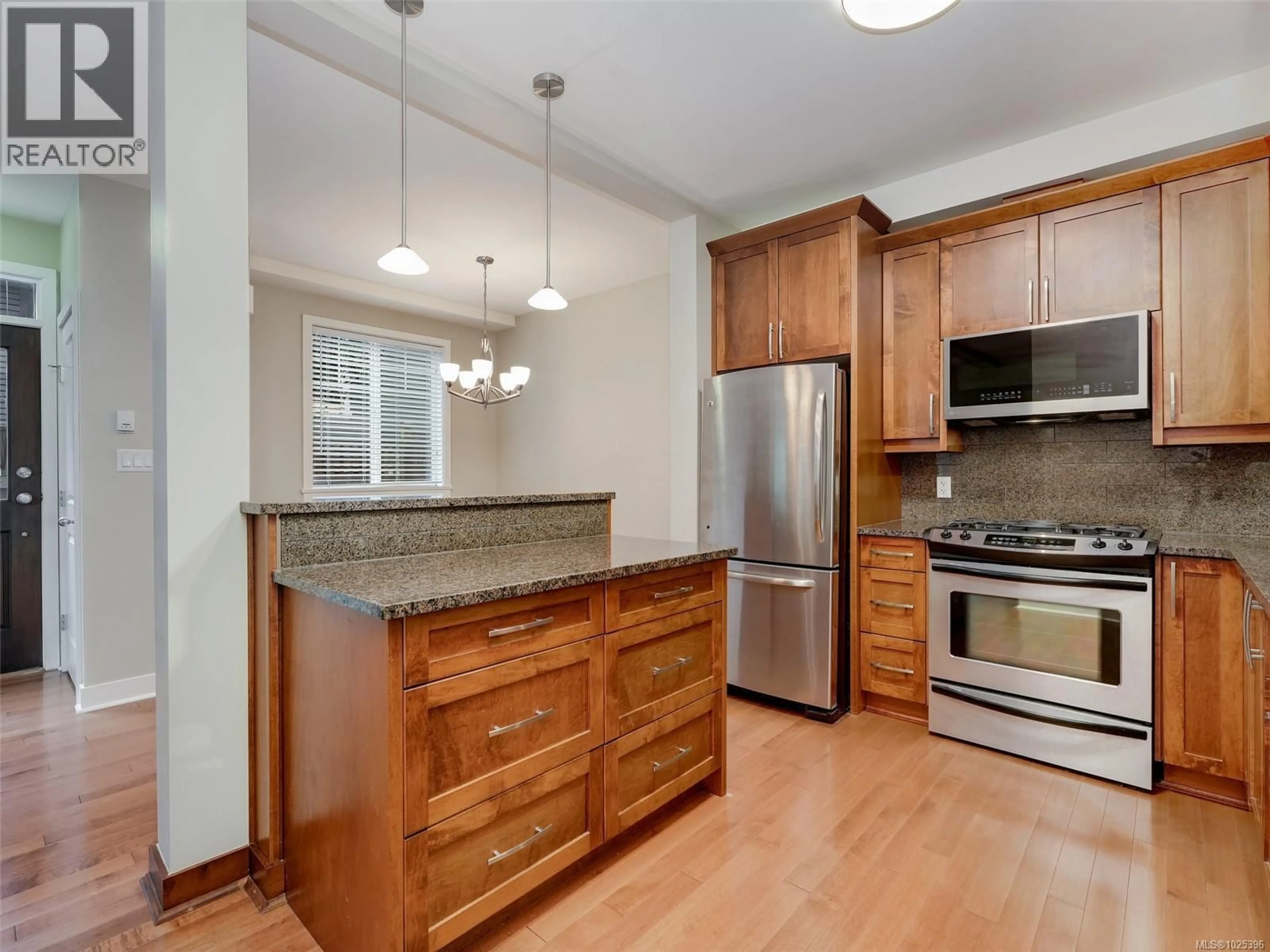 Open concept kitchen, wood/laminate floor for 2 - 1217 MCKENZIE STREET, Victoria British Columbia V8V2W6