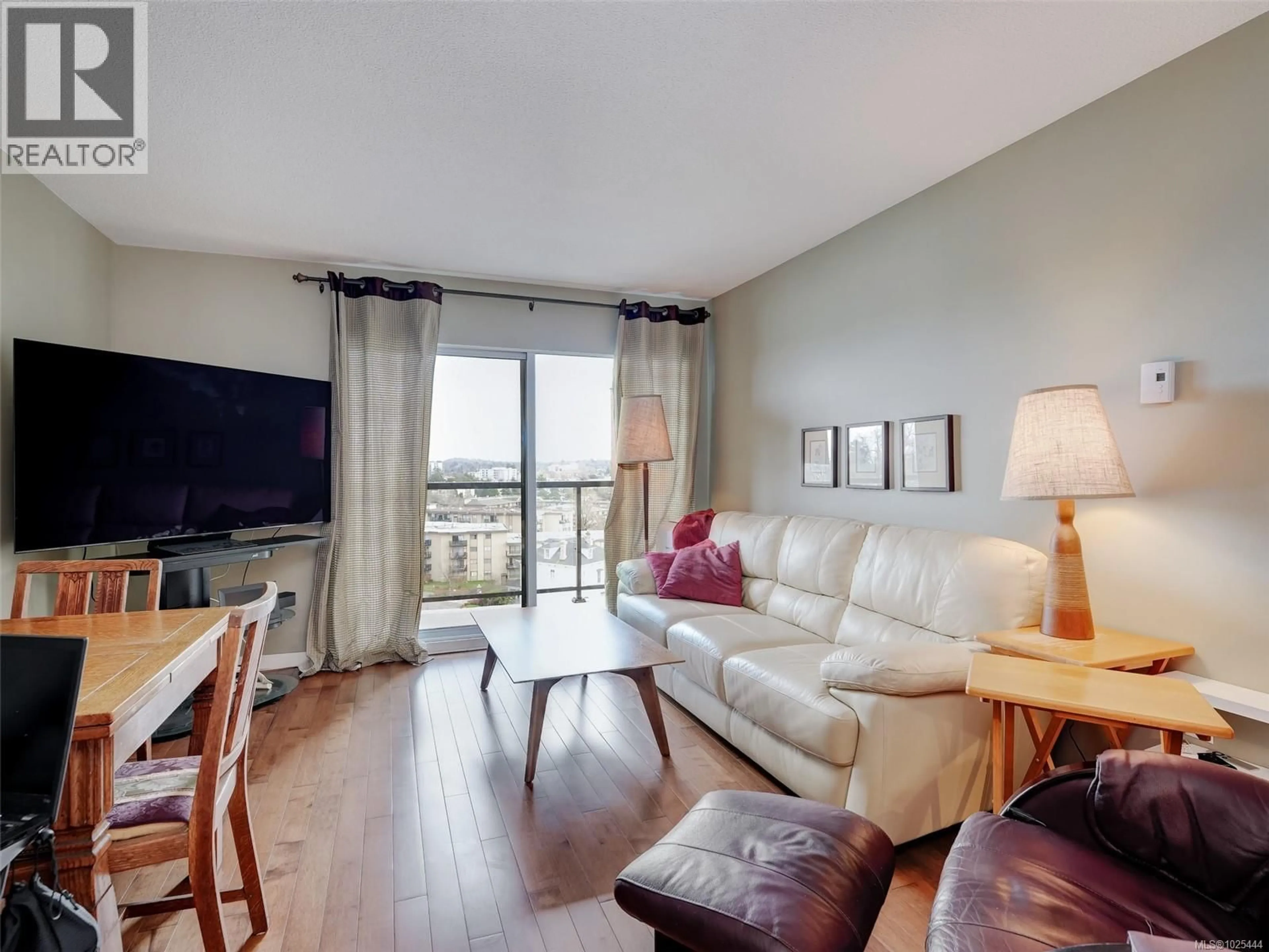 Living room with furniture, wood/laminate floor for 709 - 103 GORGE ROAD EAST, Victoria British Columbia V9A6Z2