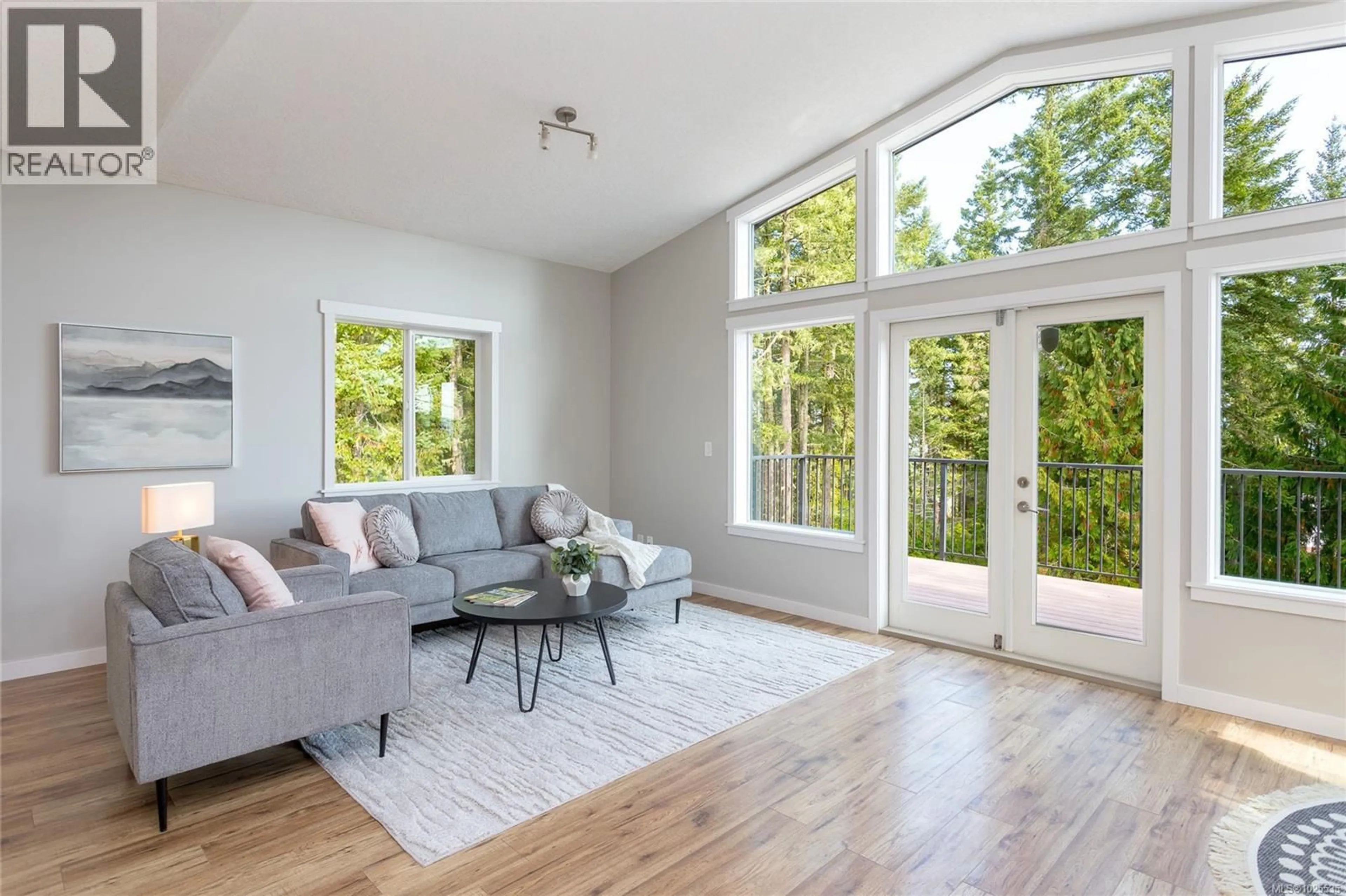 Living room with furniture, wood/laminate floor for 1668 COLE ROAD, Sooke British Columbia V9Z1A9