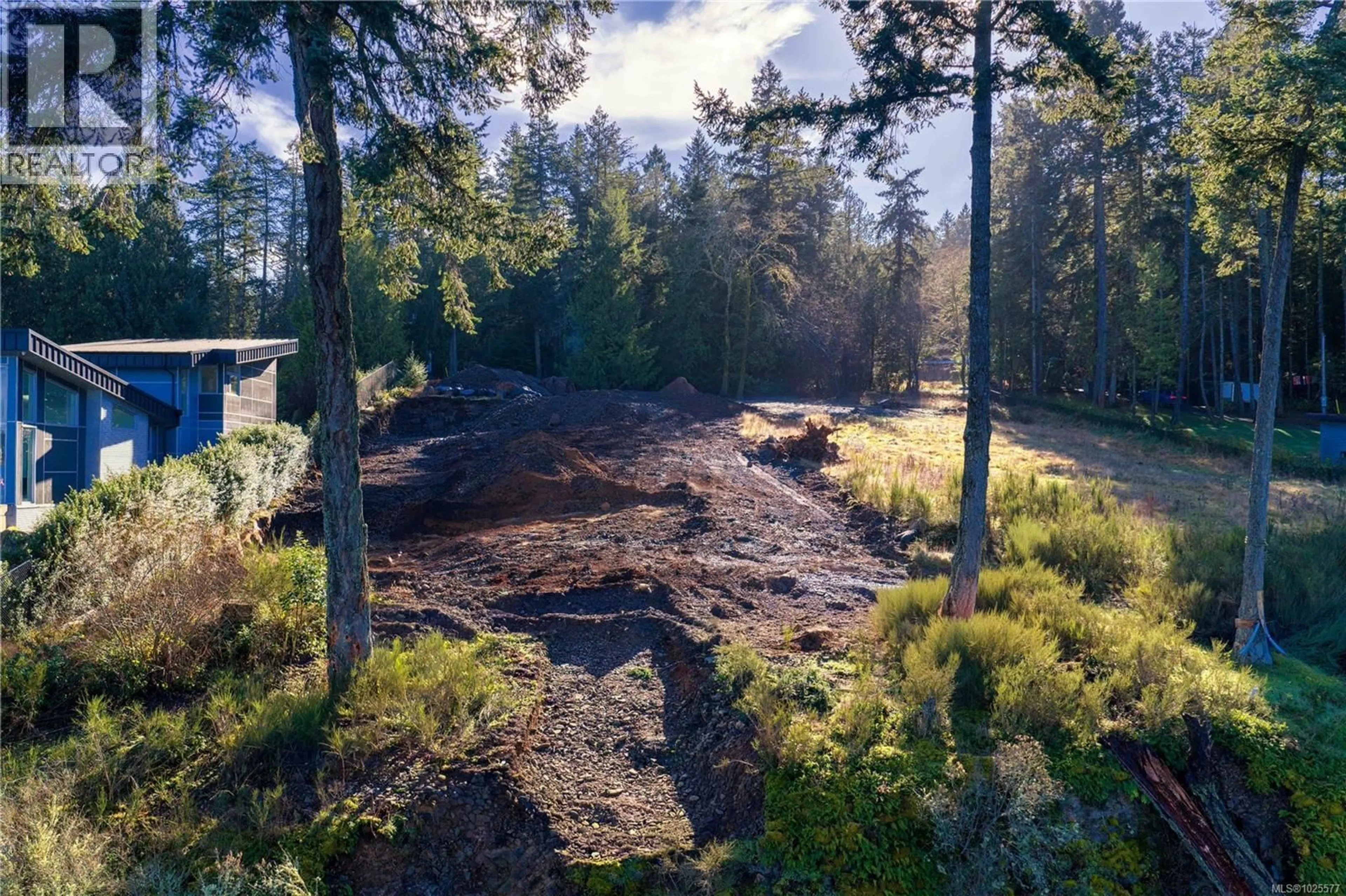 A pic from outside/outdoor area/front of a property/back of a property/a pic from drone, forest/trees view for 770 LANDS END ROAD, North Saanich British Columbia V8L5K9