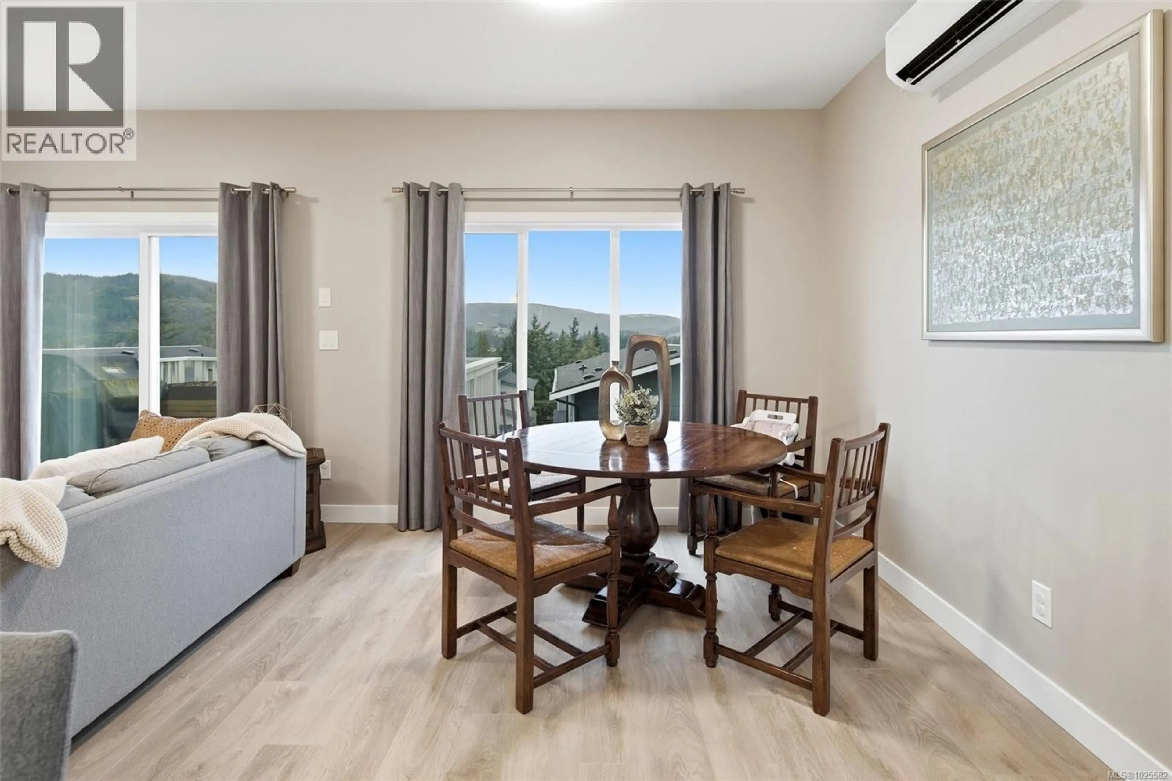 Living room with furniture, wood/laminate floor for 3481 MYLES MANSELL ROAD, Langford British Columbia V9C0N6