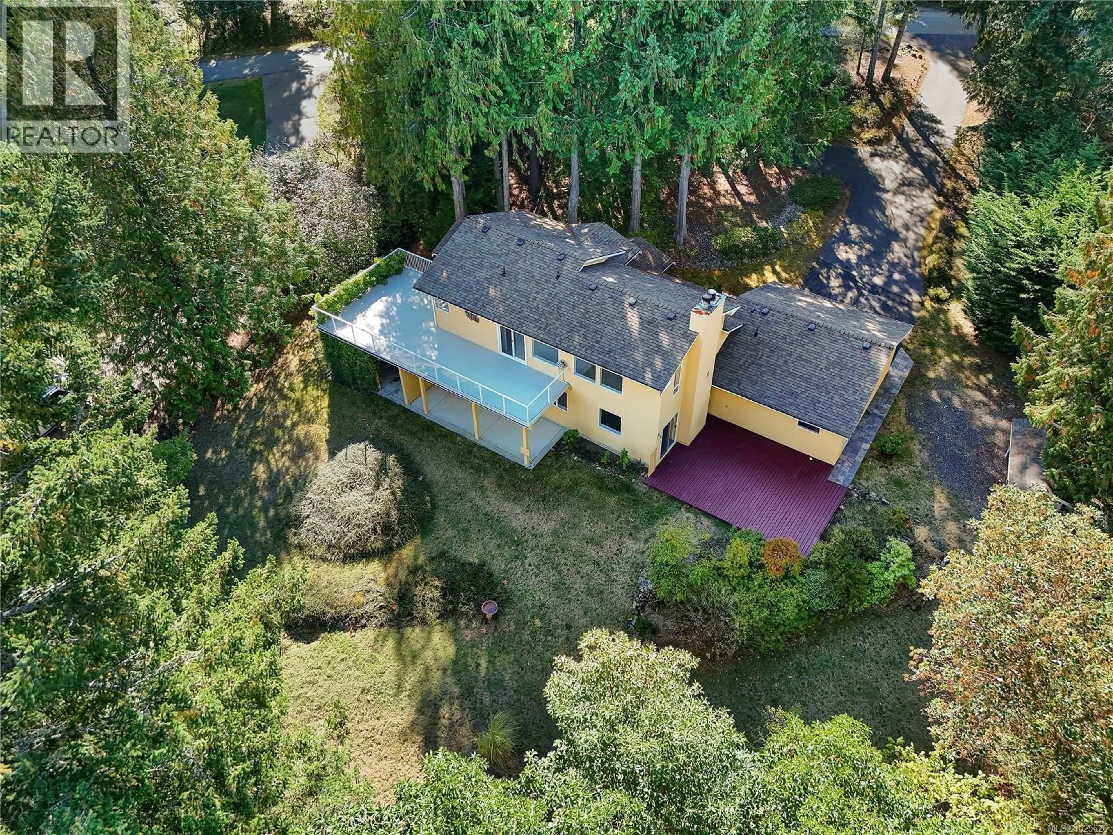 A pic from outside/outdoor area/front of a property/back of a property/a pic from drone, forest/trees view for 1470 HONEYSUCKLE PLACE, North Saanich British Columbia V8L5J8