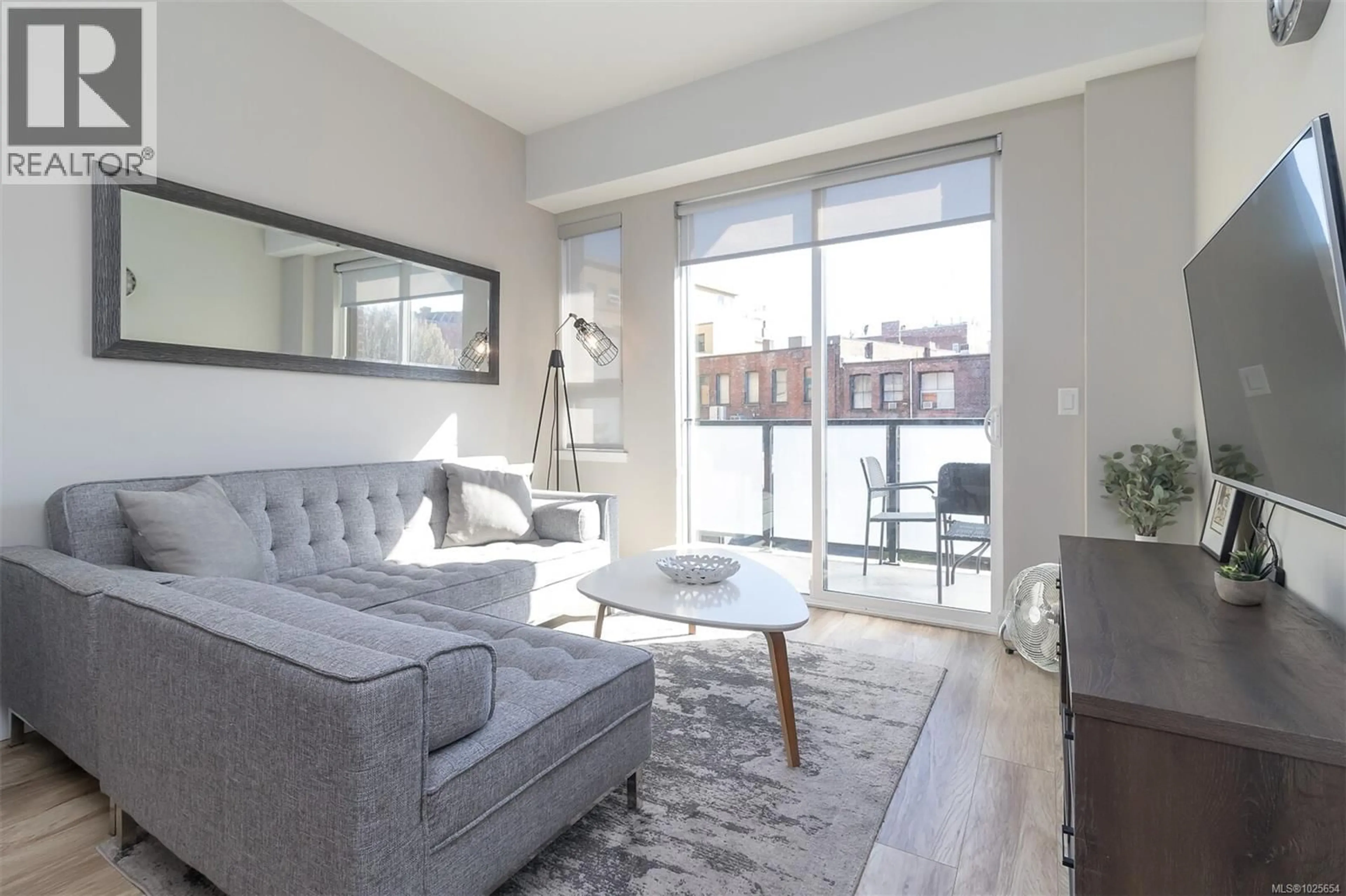 Living room with furniture, unknown for 210 - 595 PANDORA AVENUE, Victoria British Columbia V8W1N5