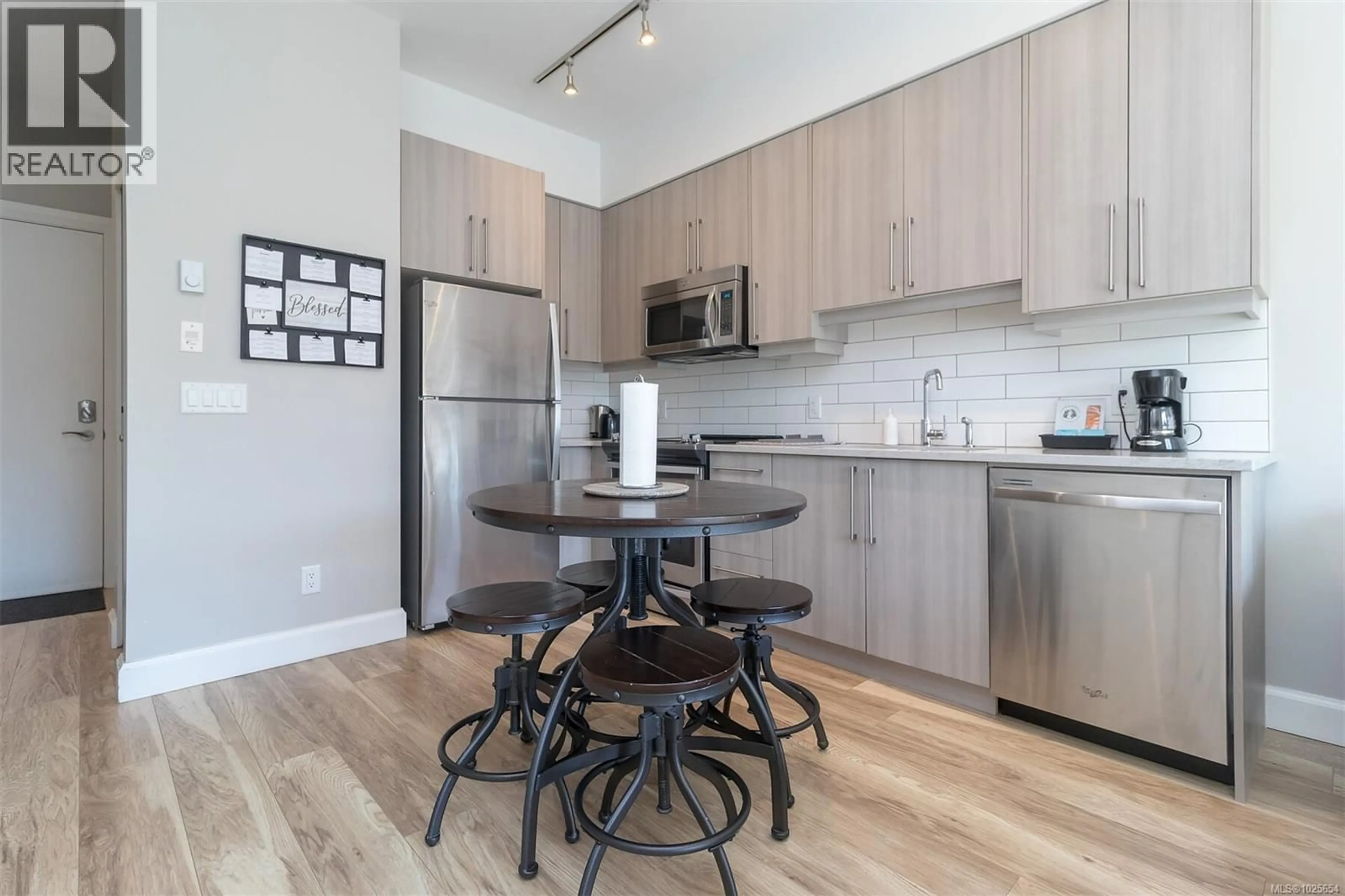 Standard kitchen, wood/laminate floor for 210 - 595 PANDORA AVENUE, Victoria British Columbia V8W1N5