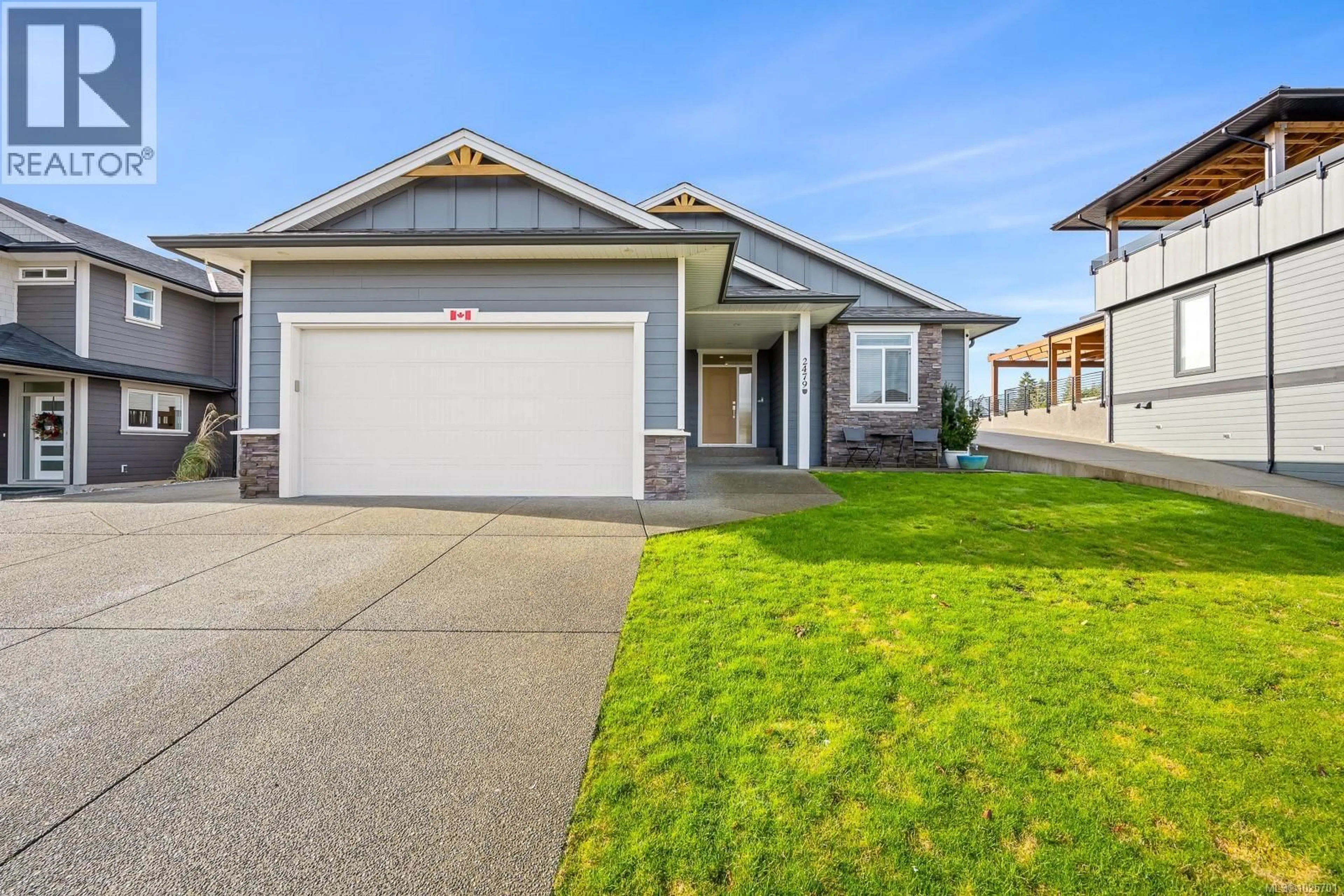 Home with vinyl exterior material, street for 2479 KENTMERE AVENUE, Cumberland British Columbia V0R1S0