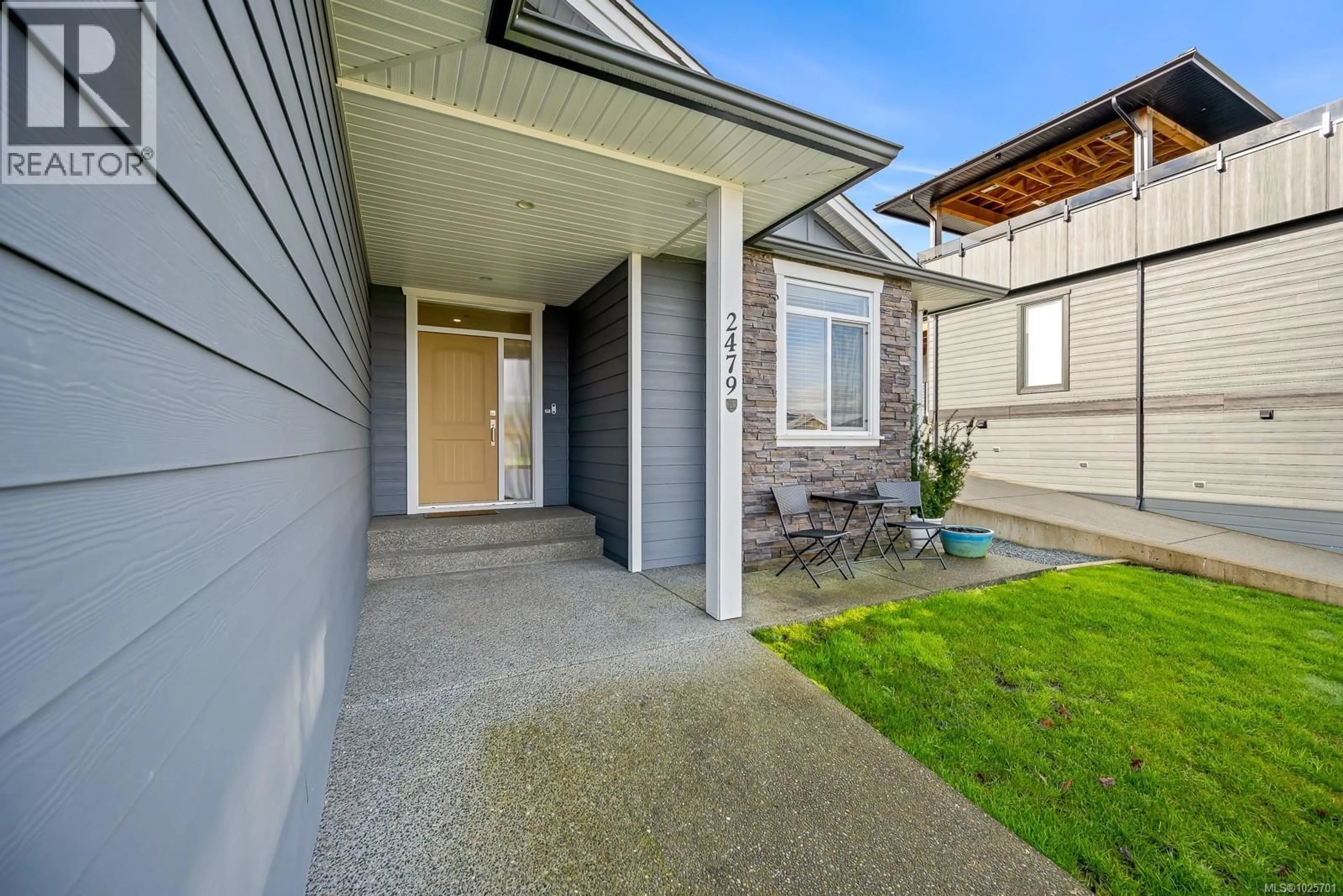 Home with vinyl exterior material, street for 2479 KENTMERE AVENUE, Cumberland British Columbia V0R1S0