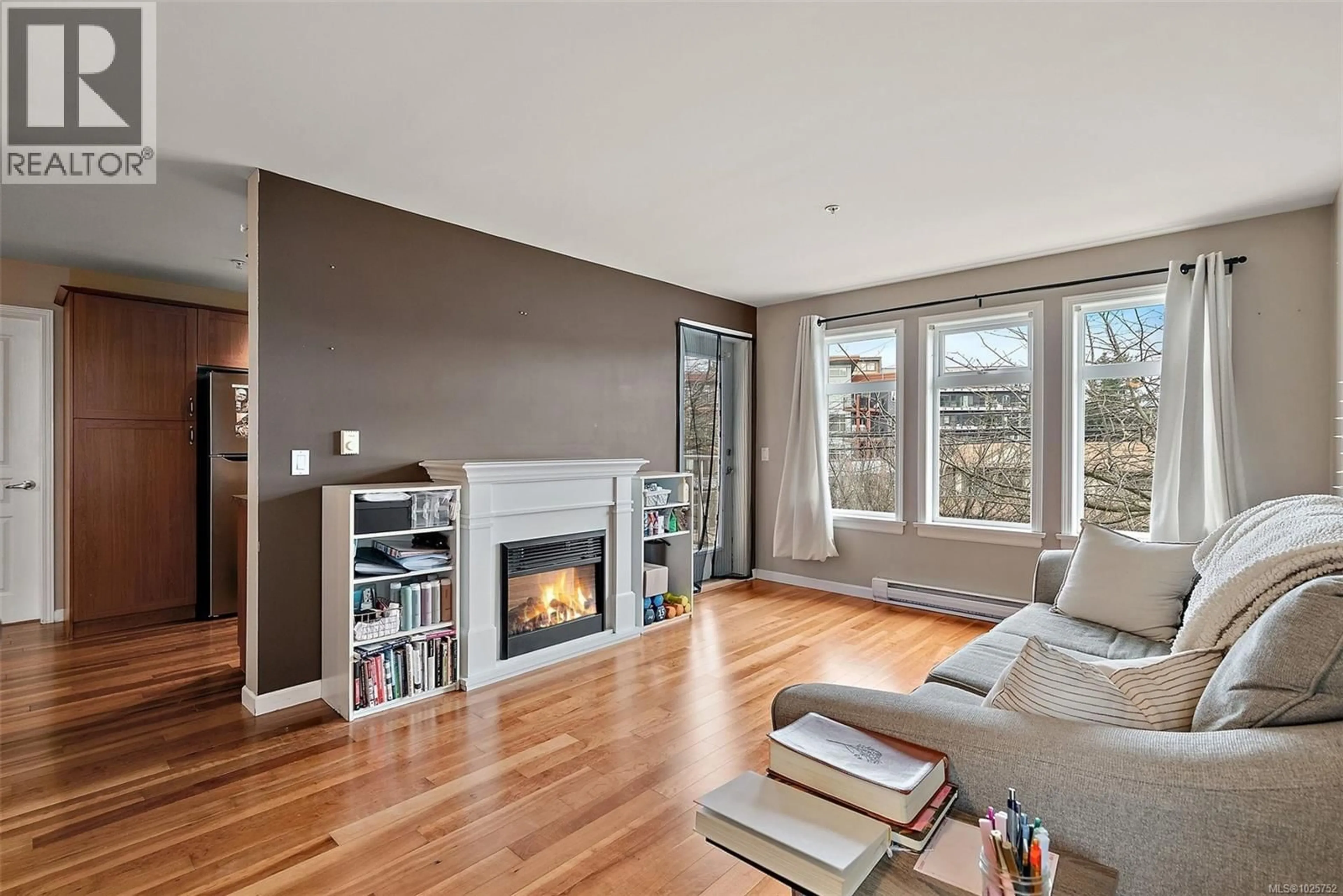 Living room with furniture, wood/laminate floor for 306 - 655 GOLDSTREAM AVENUE, Langford British Columbia V9B0G2