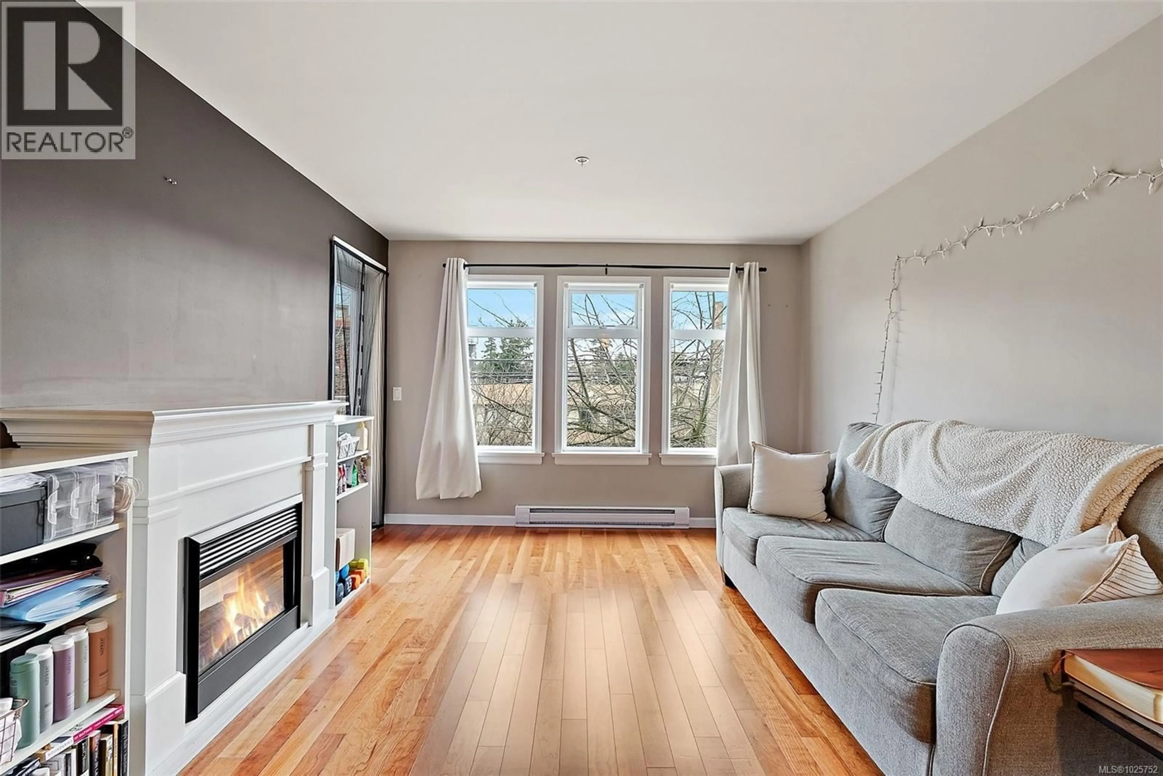 Living room with furniture, wood/laminate floor for 306 - 655 GOLDSTREAM AVENUE, Langford British Columbia V9B0G2