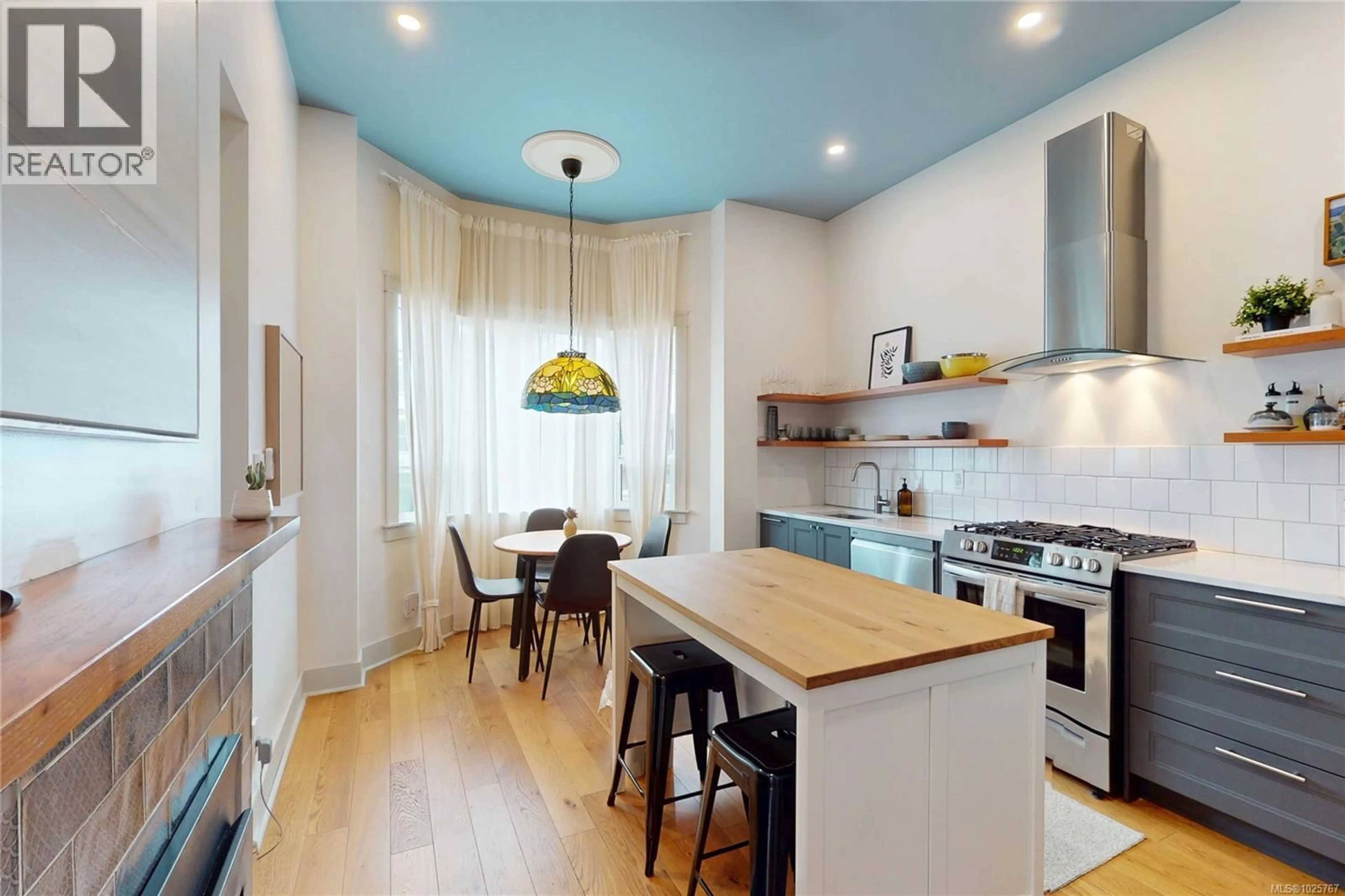 Open concept kitchen, wood/laminate floor for 1709 FERNWOOD ROAD, Victoria British Columbia V8T2Y3