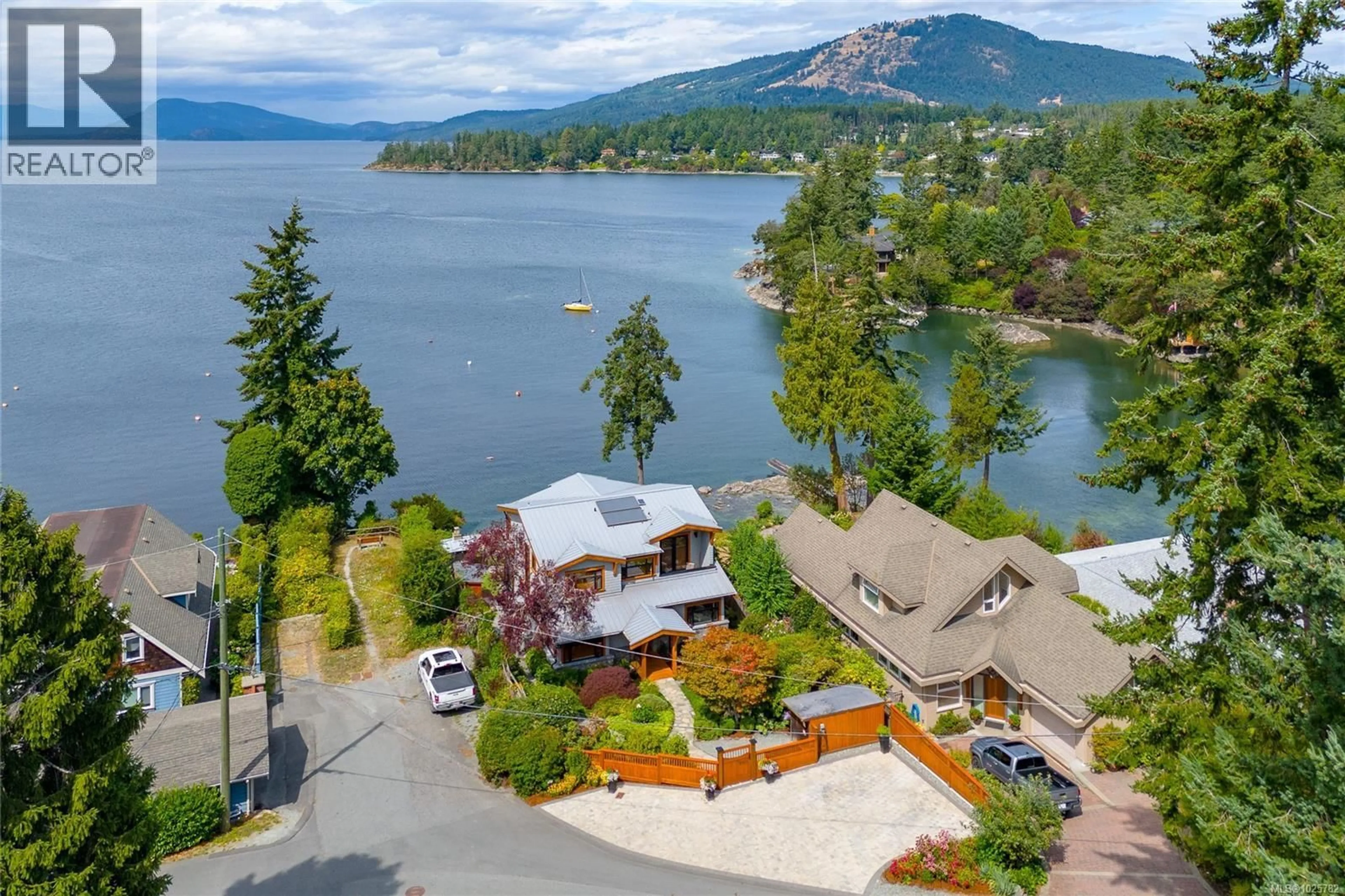 A pic from outside/outdoor area/front of a property/back of a property/a pic from drone, water/lake/river/ocean view for 580 MELDRAM DRIVE, North Saanich British Columbia V8L5V8