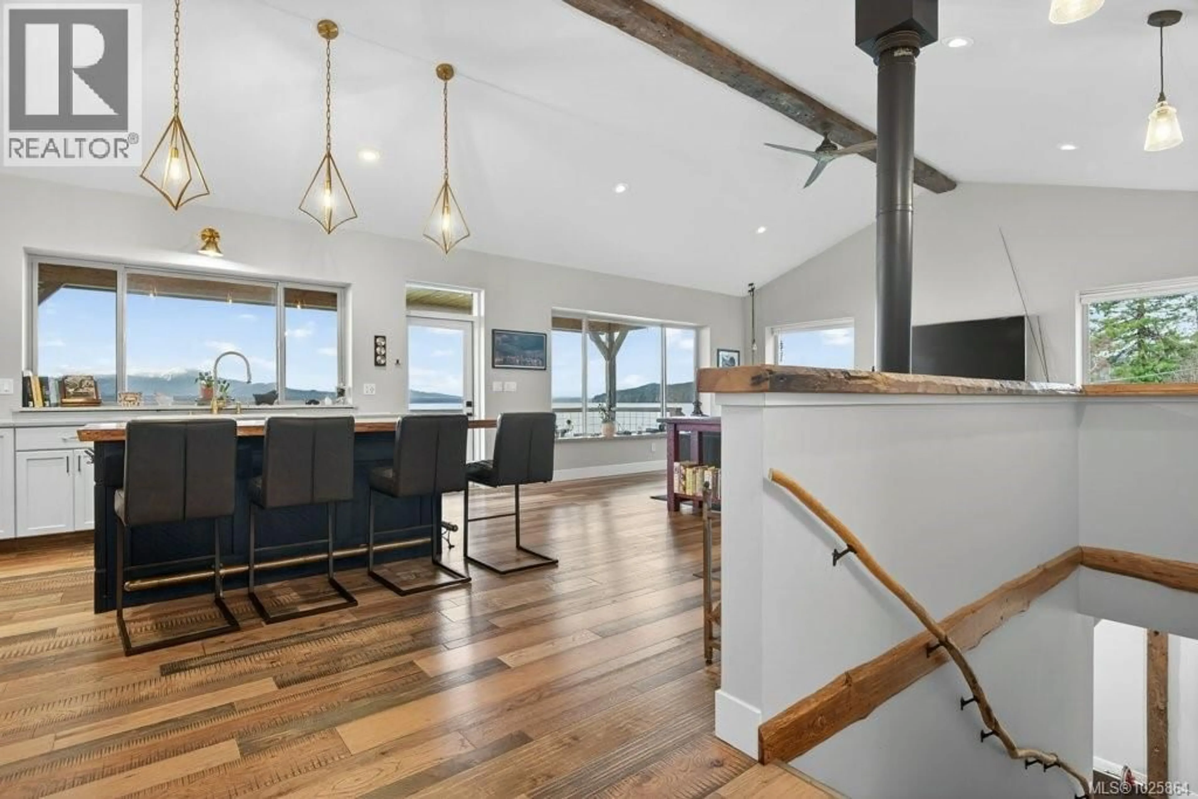 Open concept kitchen, wood/laminate floor for 420 1ST STREET, Sointula British Columbia V0N3E0