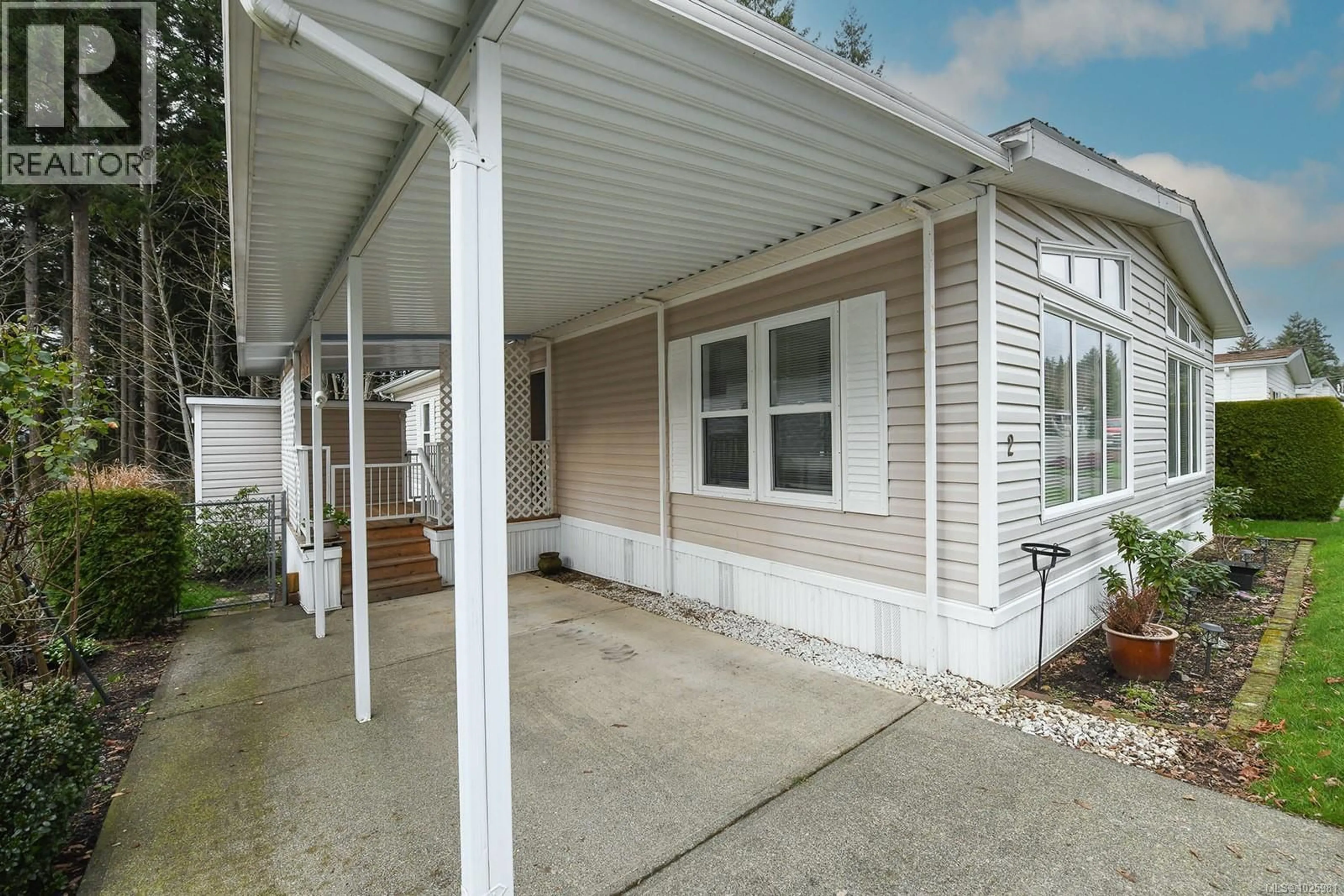 Home with vinyl exterior material, street for 2 - 4714 MUIR ROAD, Courtenay British Columbia V9N8Z6