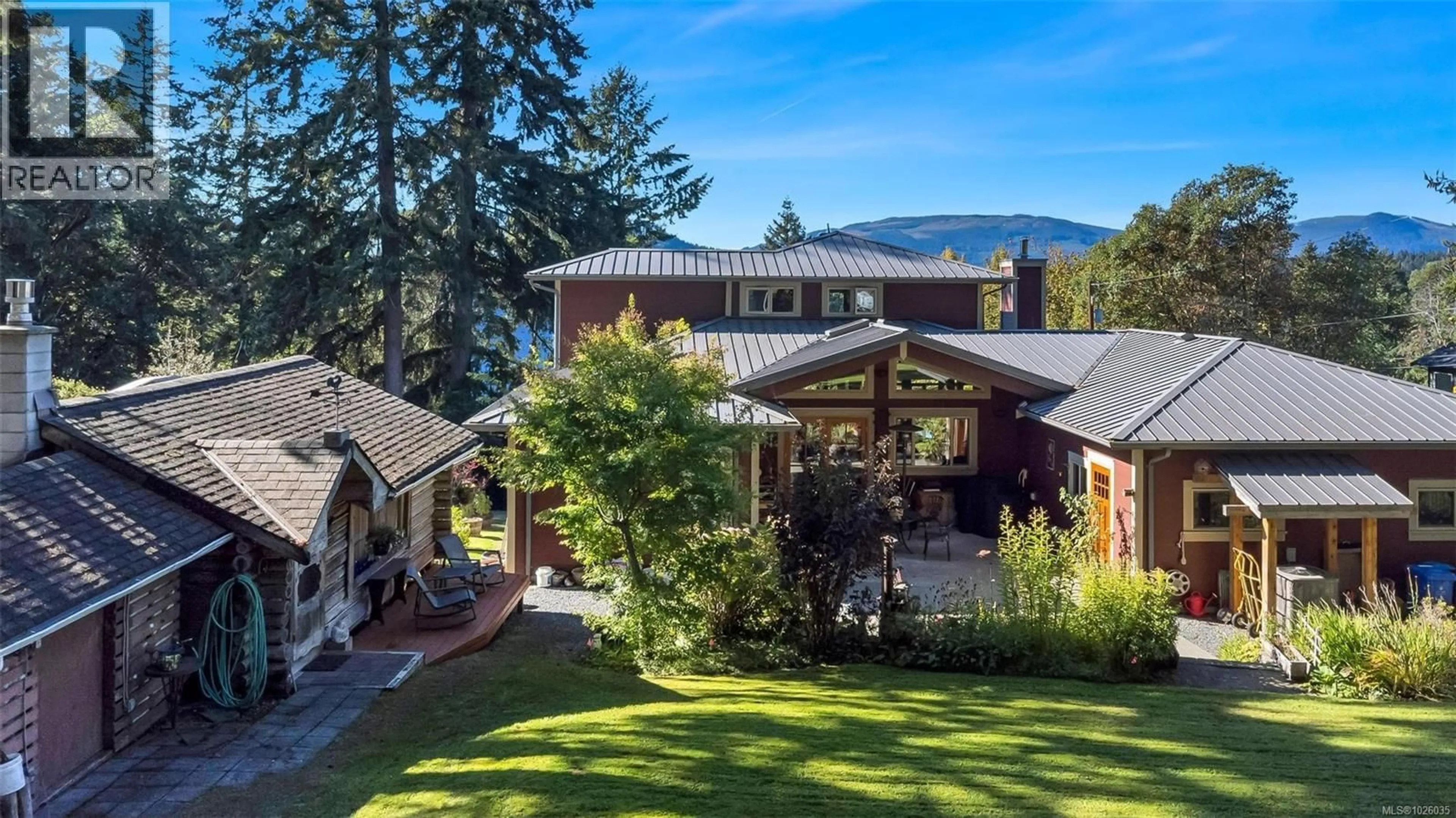 A pic from outside/outdoor area/front of a property/back of a property/a pic from drone, mountain view for 1870 MUNSIE ROAD, Shawnigan Lake British Columbia V8H2A8