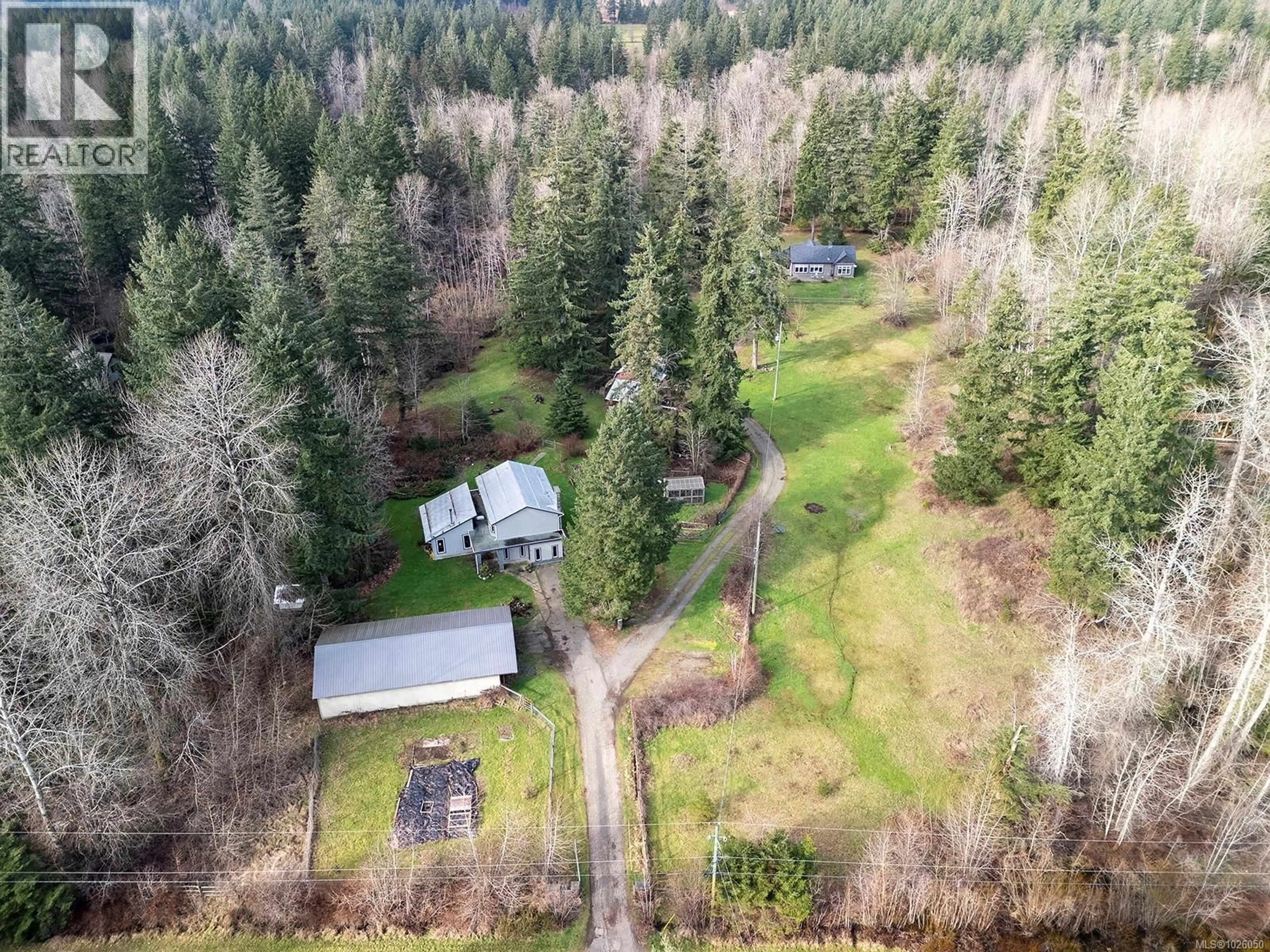 A pic from outside/outdoor area/front of a property/back of a property/a pic from drone, forest/trees view for 3142-3144 HELLICAR ROAD, Merville British Columbia V9J1M8