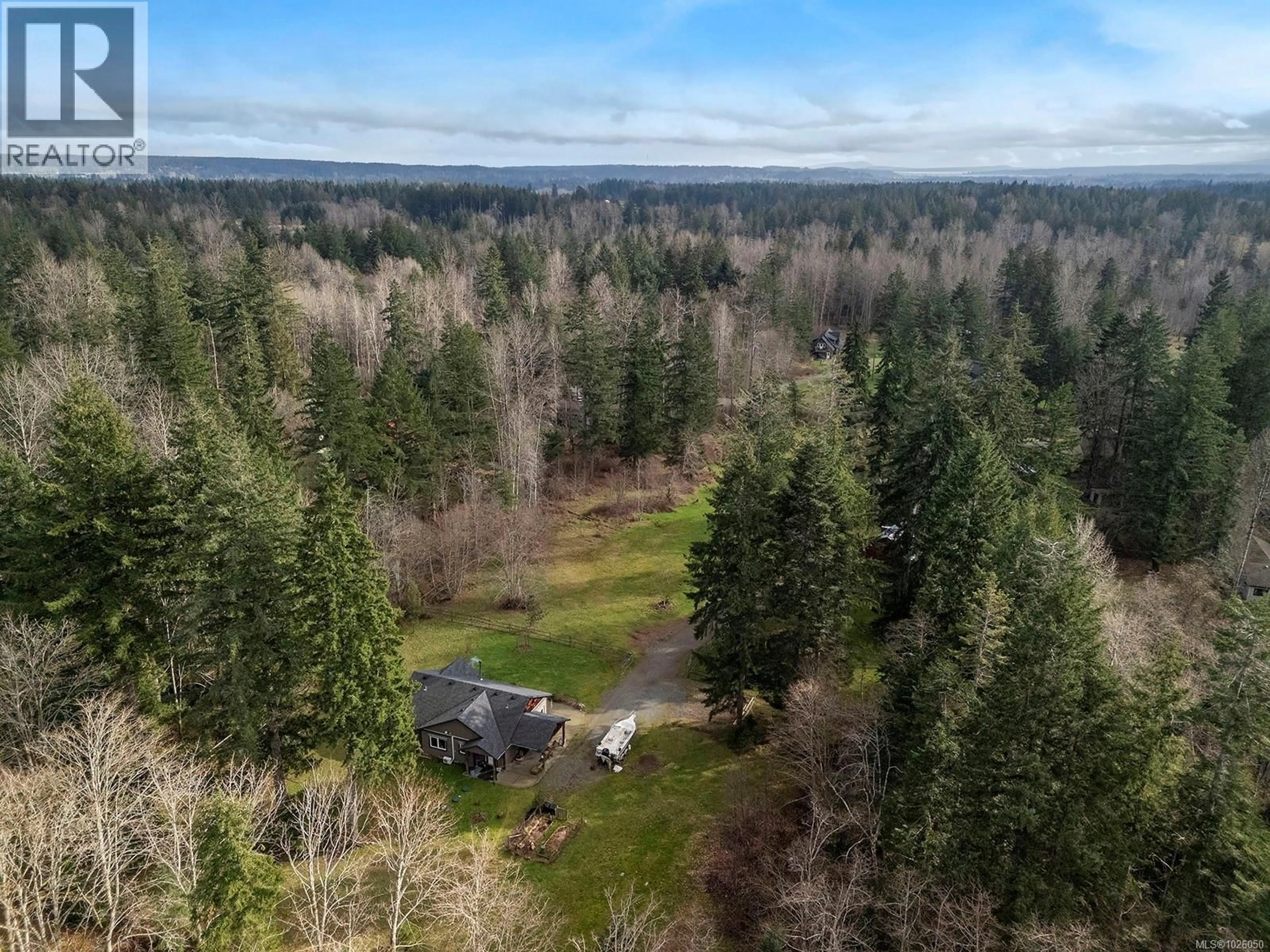A pic from outside/outdoor area/front of a property/back of a property/a pic from drone, forest/trees view for 3142-3144 HELLICAR ROAD, Merville British Columbia V9J1M8